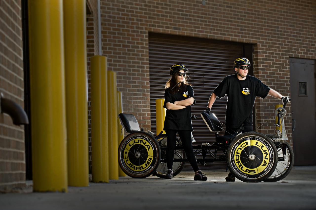 HUNTSVILLE CENTER FOR TECHNOLOGY’S FRANCHESCA QUIJANO AND HUNTER FLECKNER POSE WITH THE MOONBUGGY THEY WILL DRIVE IN THE 2011 GREAT MOONBUGGY RACE AT THE US SPACE AND ROCKET CENTER
