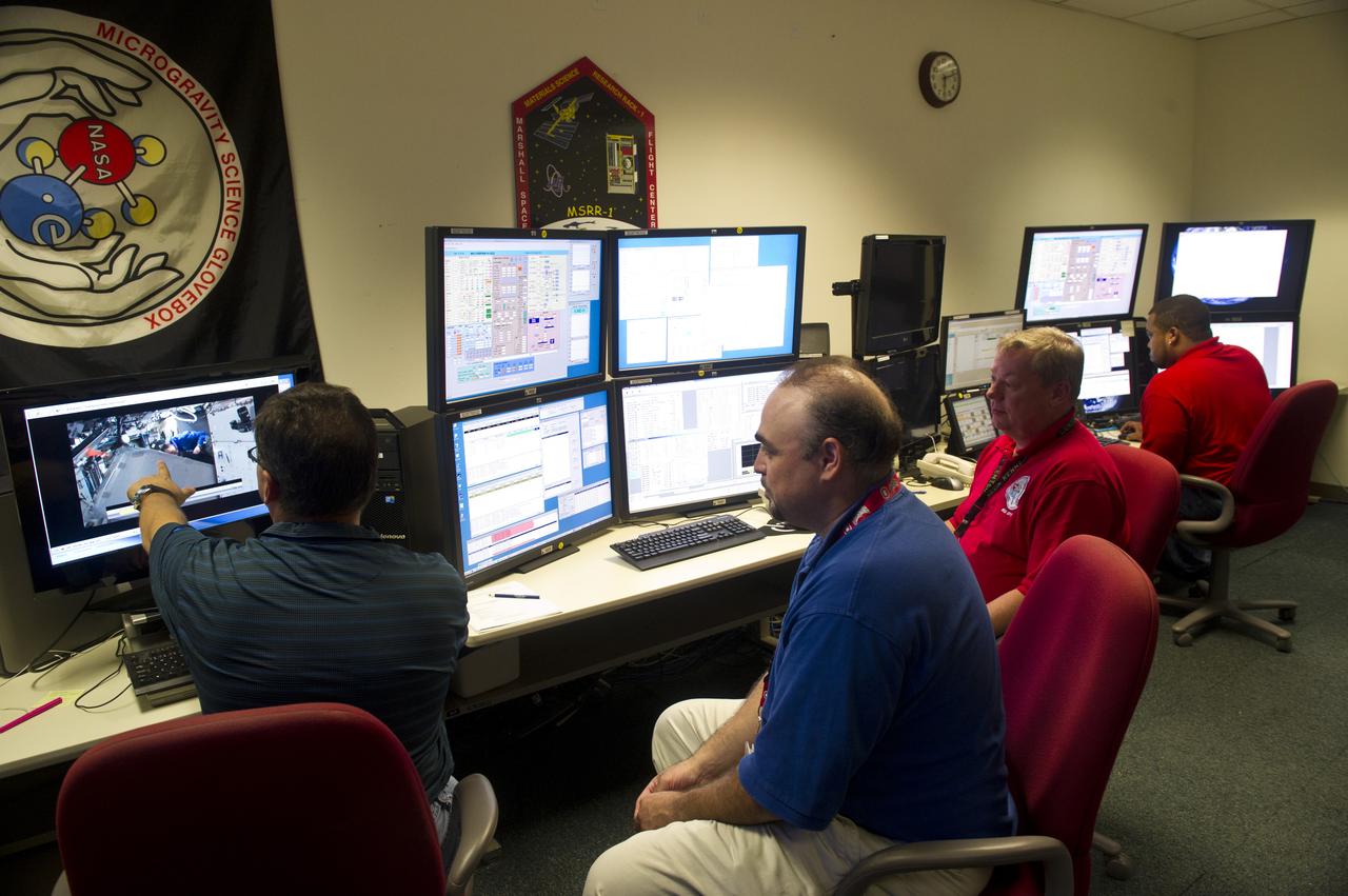 ED BERMEA, (BLUE SHIRT), AND MSG TEAM MEMBERS AT CONSOLE