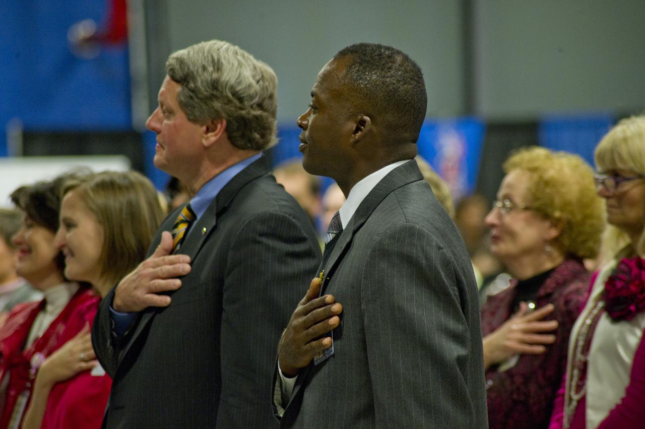 MSFC DEPUTY DIRECTOR GENE GOLDMAN AND SIRAN STACY, KEYNOTE SPEAKER FOR CFC "THANKS FOR GIVING" PROGRAM, WITH HANDS ON HEART DURING SINGING OF NATIONAL ANTHEM