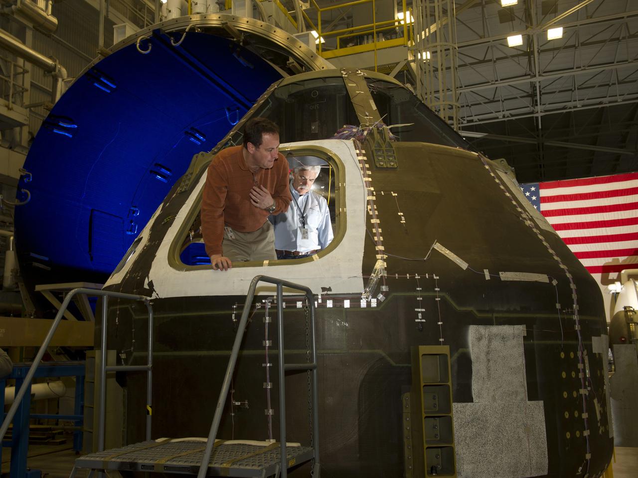 CENTER DIRECTOR ROBERT LIGHTFOOT AND  MATERIALS ENGINEER LARRY PELHAM, EXAMINE COMPOSITE CREW MODULE AT THE ENVIRONMENTAL TEST FACILITY IN BLDG. 4619 AS MODULE IS BEING PREPARED FOR SPACE ENVIRONMENTAL TESTING. 