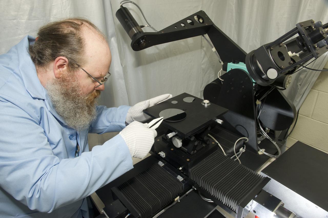 JOEY NORWOOD WITH VARIABLE ANGLE SPECTROSCOPIC ELLIPSOMETER (VASE) FOR THIN FILM ANALYSIS.