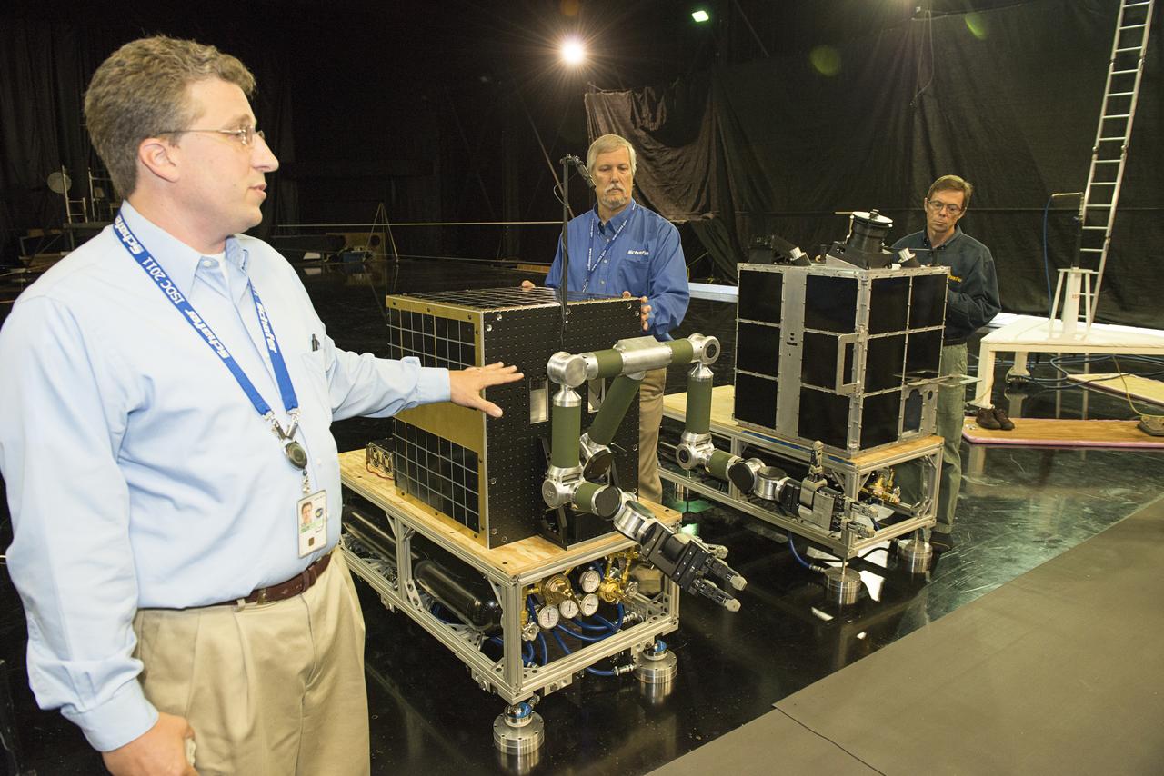 FINAL DEMONSTRATION OF A WIRELESS DATA TASK SUPPORTED BY SLS ADVANCED DEVELOPMENT USED TO DEMONSTRATE REAL-TIME VIDEO OVER WIRELESS CONNECTIONS ALONG WITH DATA AND COMMANDS AS DEMONSTRATED VIA THE ROBOTIC ARMS. THE ARMS AND VIDEO CAMERAS WERE MOUNTED ON FREE FLOATING AIR-BEARING VEHICLES TO SIMULATE CONDITIONS IN SPACE. THEY WERE USED TO SHOW HOW A CHASE VEHICLE COULD MOVE UP TO AND CAPTURE A SATELLITE, SUCH AS THE FASTSAT MOCKUP DEMONSTRITING HOW ROBOTIC TECHNOLOGY AND SMALL SPACECRAFT COULD ASSIST WITH ORBITAL DEBRIS MITIGATION