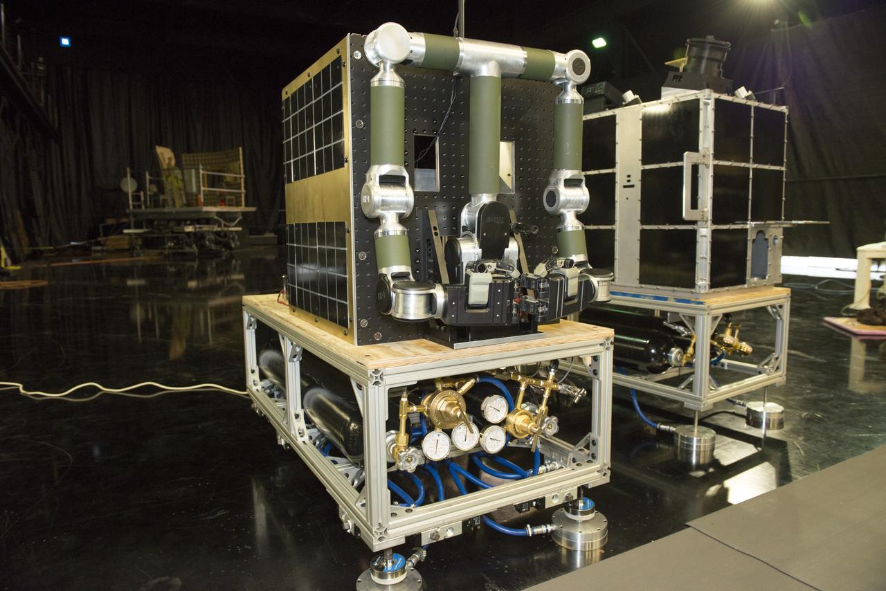 FINAL DEMONSTRATION OF A WIRELESS DATA TASK SUPPORTED BY SLS ADVANCED DEVELOPMENT USED TO DEMONSTRATE REAL-TIME VIDEO OVER WIRELESS CONNECTIONS ALONG WITH DATA AND COMMANDS AS DEMONSTRATED VIA THE ROBOTIC ARMS. THE ARMS AND VIDEO CAMERAS WERE MOUNTED ON FREE FLOATING AIR-BEARING VEHICLES TO SIMULATE CONDITIONS IN SPACE. THEY WERE USED TO SHOW HOW A CHASE VEHICLE COULD MOVE UP TO AND CAPTURE A SATELLITE, SUCH AS THE FASTSAT MOCKUP DEMONSTRITING HOW ROBOTIC TECHNOLOGY AND SMALL SPACECRAFT COULD ASSIST WITH ORBITAL DEBRIS MITIGATION