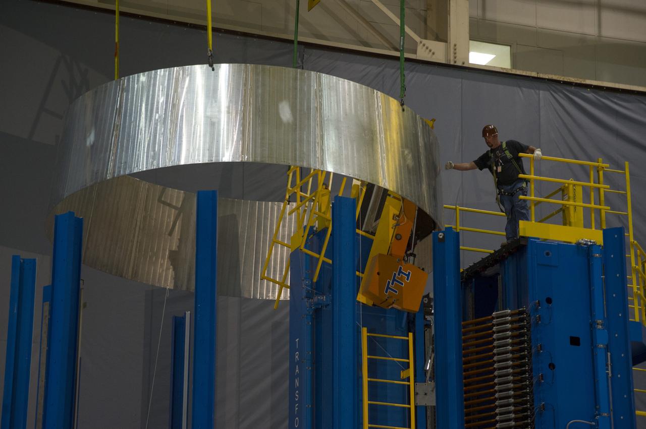 ENGINEERS USING A STATE-OF-THE-ART VERTICAL WELDING TOOL AT THE MARSHALL SPACE FLIGHT CENTER IN HUNTSVILLE, ALA., MOVE A "PATHFINDER" VERSION OF THE ADAPTER DESIGN THAT WILL BE USED ON TEST FLIGHTS OF THE ORION SPACECRAFT AND NASA'S SPACE LAUNCH SYSTEM