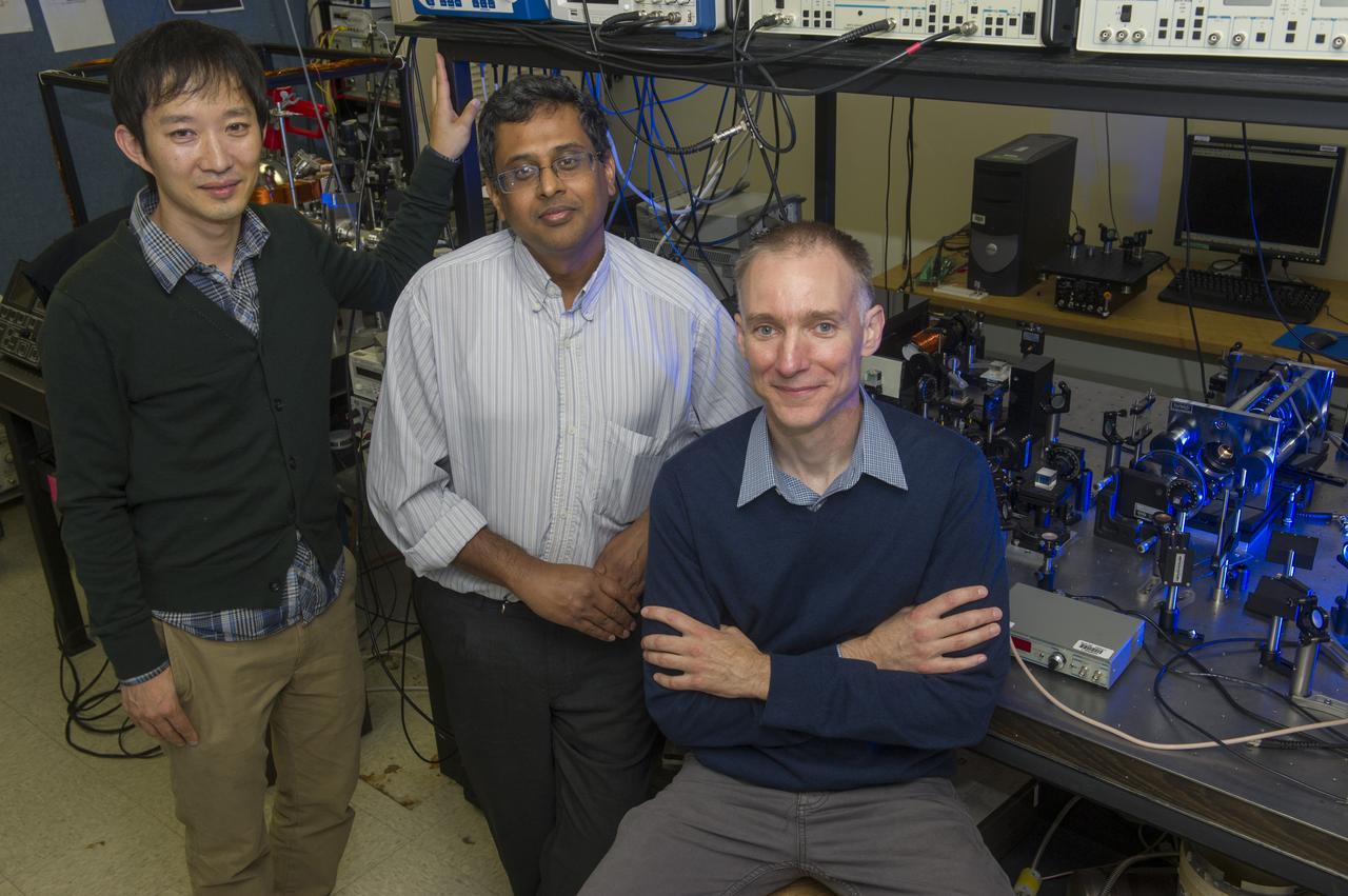 FROM RIGHT, MARSHALL RESEARCHER DR. DAVID SMITH, U.S. ARMY RESEARCHER KRISHNA MYNENI AND ARMY CONTRACTOR HONGROK CHANG HAVE BEGUN A THREE-YEAR NASA PROJECT TO DEVELOP INNOVATIVE NEW GYROSCOPES THAT COULD DRAMATICALLY IMPROVE IN-FLIGHT NAVIGATION CAPABILITIES FOR SPACE VEHICLES, MILITARY AIR AND SEA ASSETS AND COMMERCIAL VEHICLES. THE “FAST LIGHT OPTICAL GYROSCOPES FOR PRECISE INERTIAL NAVIGATION” PROJECT INCLUDES RESEARCHERS AT NASA’S MARSHALL SPACE FLIGHT CENTER IN HUNTSVILLE, ALA.; THE U.S. ARMY AVIATION AND MISSILE RESEARCH, DEVELOPMENT AND ENGINEERING CENTER (AMRDEC) AT REDSTONE ARSENAL IN HUNTSVILLE; AND NORTHWESTERN UNIVERSITY IN EVANSTON, ILL.  