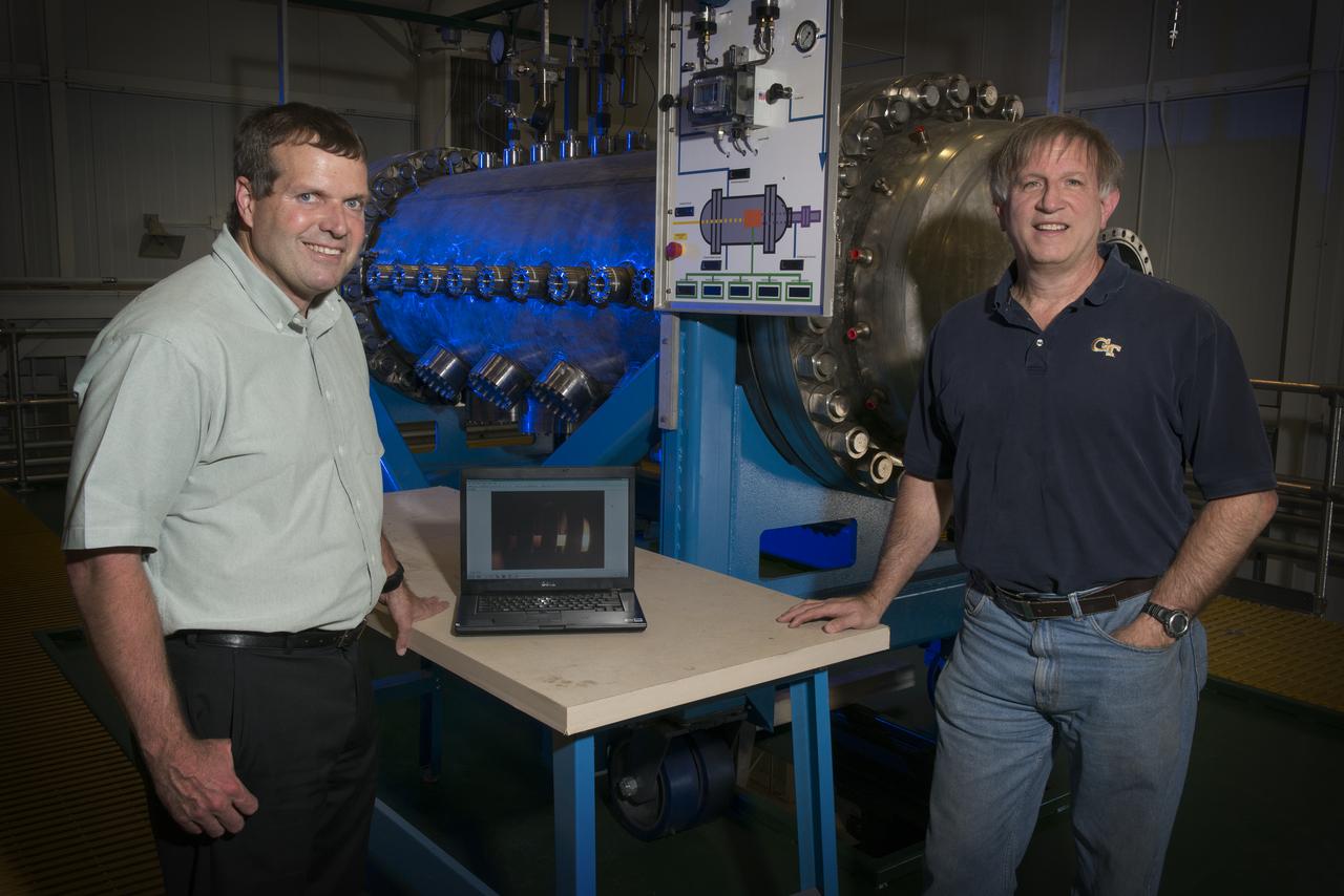 MIKE HOUTS AND BILL EMRICH DISCUSSING NUCLEAR THERMAL ROCKET ELEMENT ENVIRONMENTAL SIMULATOR (NTREES) IN BUILDING 4205. MIKE HOUTS IS THE PROJECT MANAGER.