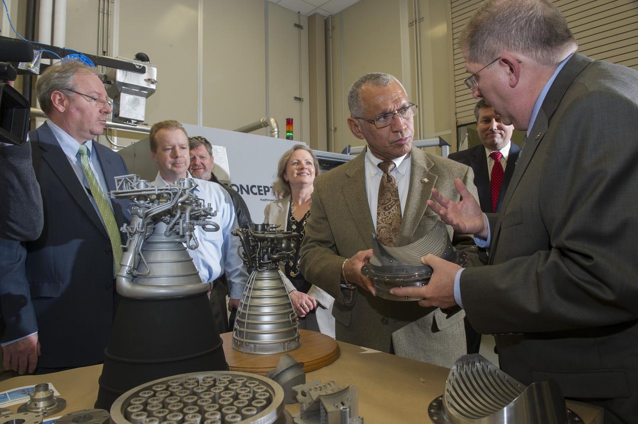 DURING HIS FEB. 22 VISIT TO THE NATIONAL CENTER FOR ADVANCED MANUFACTURING RAPID PROTOTYPING FACILITY AT NASA'S MARSHALL SPACE FLIGHT CENTER, NASA ADMINISTRATOR CHARLES BOLDEN, CENTER, TALKS WITH FRANK LEDBETTER, RIGHT, CHIEF OF THE NONMETALLIC MATERIALS AND MANUFACTURING DIVISION AT MARSHALL, ABOUT THE USE OF 3-D PRINTING AND PROTOTYPING TECHNOLOGY TO CREATE PARTS FOR THE SPACE LAUNCH SYSTEM. ALSO PARTICIPATING IN THE TOUR ARE, FROM BACK RIGHT, MARSHALL CENTER DIRECTOR PATRICK SCHEUERMANN; SHERRY KITTREDGE, DEPUTY MANAGER OF THE SLS LIQUID ENGINES OFFICE; MARSHALL FLIGHT SYSTEMS DESIGN ENGINEER ROB BLACK; AND JOHN VICKERS, MANAGER OF THE NATIONAL CENTER FOR ADVANCED MANUFACTURING. 