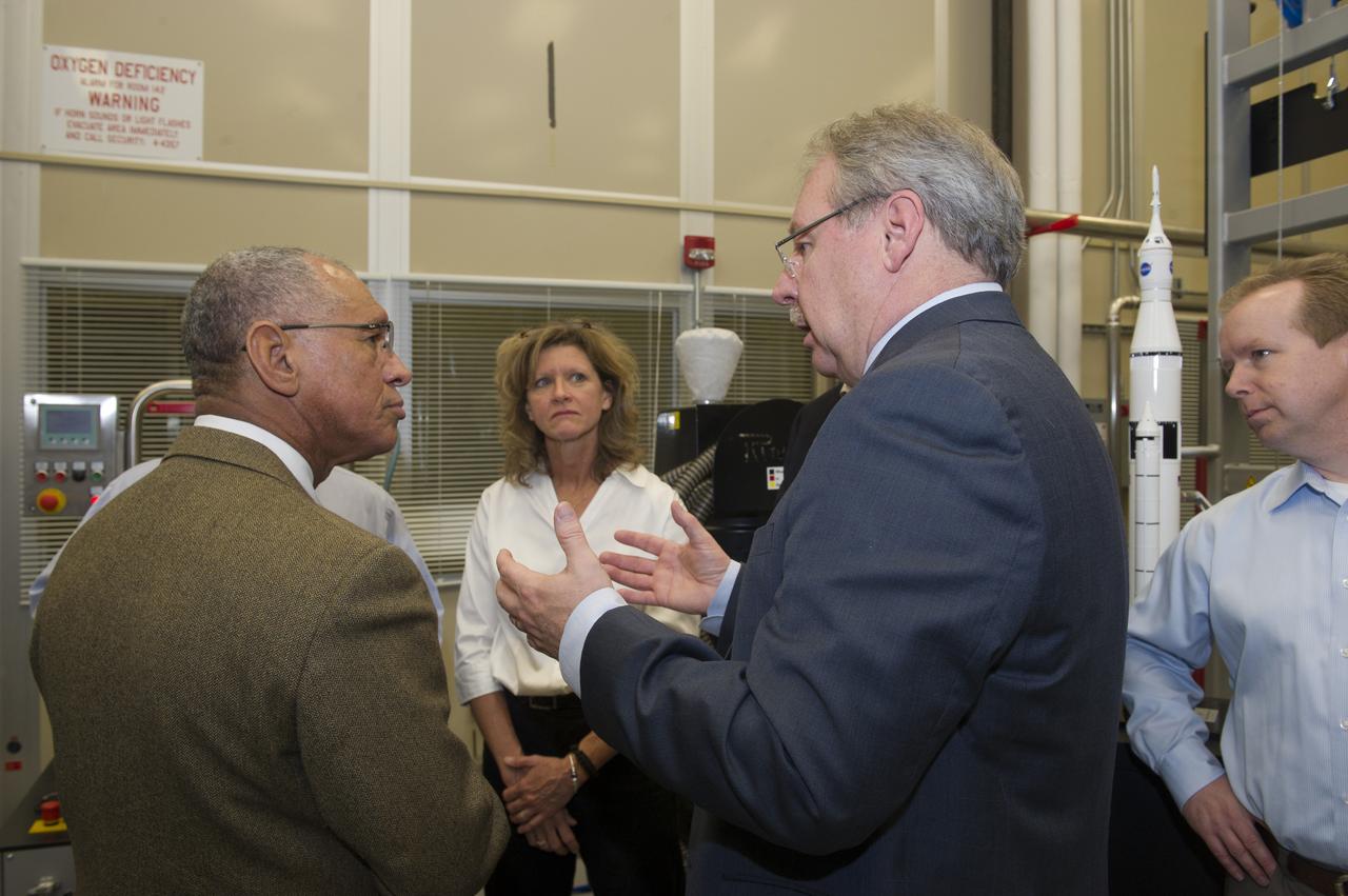 FROM LEFT, NASA ADMINISTRATOR CHARLES BOLDEN LISTENS TO MARSHALL MATERIALS ENGINEER NANCY TOLLIVER; JOHN VICKERS, MANAGER OF THE NATIONAL CENTER FOR ADVANCED MANUFACTURING; AND MARSHALL FLIGHT SYSTEMS DESIGN ENGINEER ROB BLACK AS THEY BRIEF HIM ON THE USE OF 3-D PRINTING AND PROTOTYPING TECHNOLOGY TO CREATE PARTS FOR THE SPACE LAUNCH SYSTEM