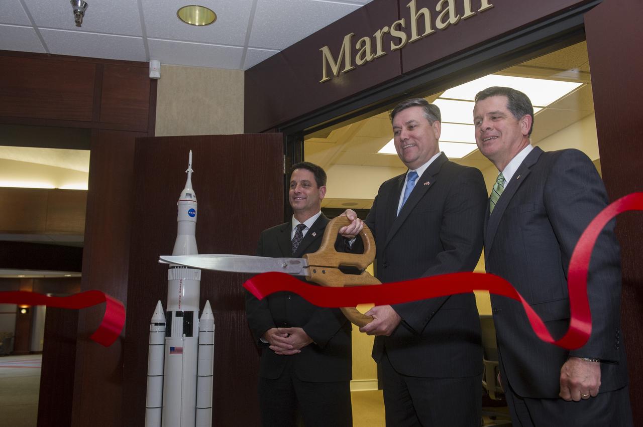 MSFC DIRECTOR PATRICK SCHEUERMANN CUTS RIBBON AT DEDICATION OF MARSHALL ROOM AT HUNTSVILLE-MADISON COUNTY CHAMBER OF COMMERCE, 3/11/13.  TROY TRULOCK (L), MAYOR OF MADISON, AL AND RON POTEAT, (R), BOARD CHAIR, CHAMBER OF COMMERCE