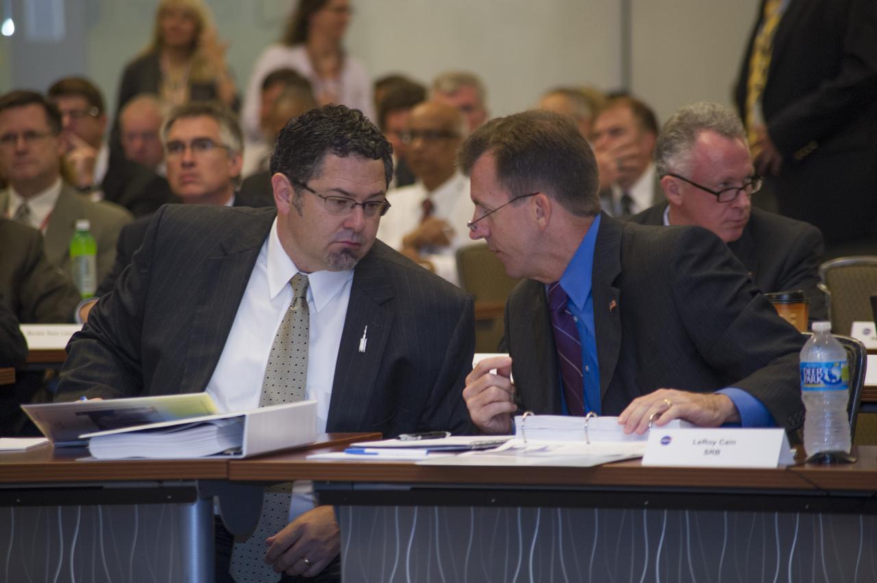 TODD MAY, LEFT, MANAGER OF THE SLS PROGRAM AT THE MARSHALL CENTER, DISCUSSES THE ROCKET'S SPECIFICATIONS WITH LEROY CAIN, WHO HEADS THE INDEPENDENT STANDING REVIEW BOARD FOR SLS, DURING THE SLS PROGRAM'S PRELIMINARY DESIGN REVIEW. THE REVIEW KICKED OFF JUNE 18-19
