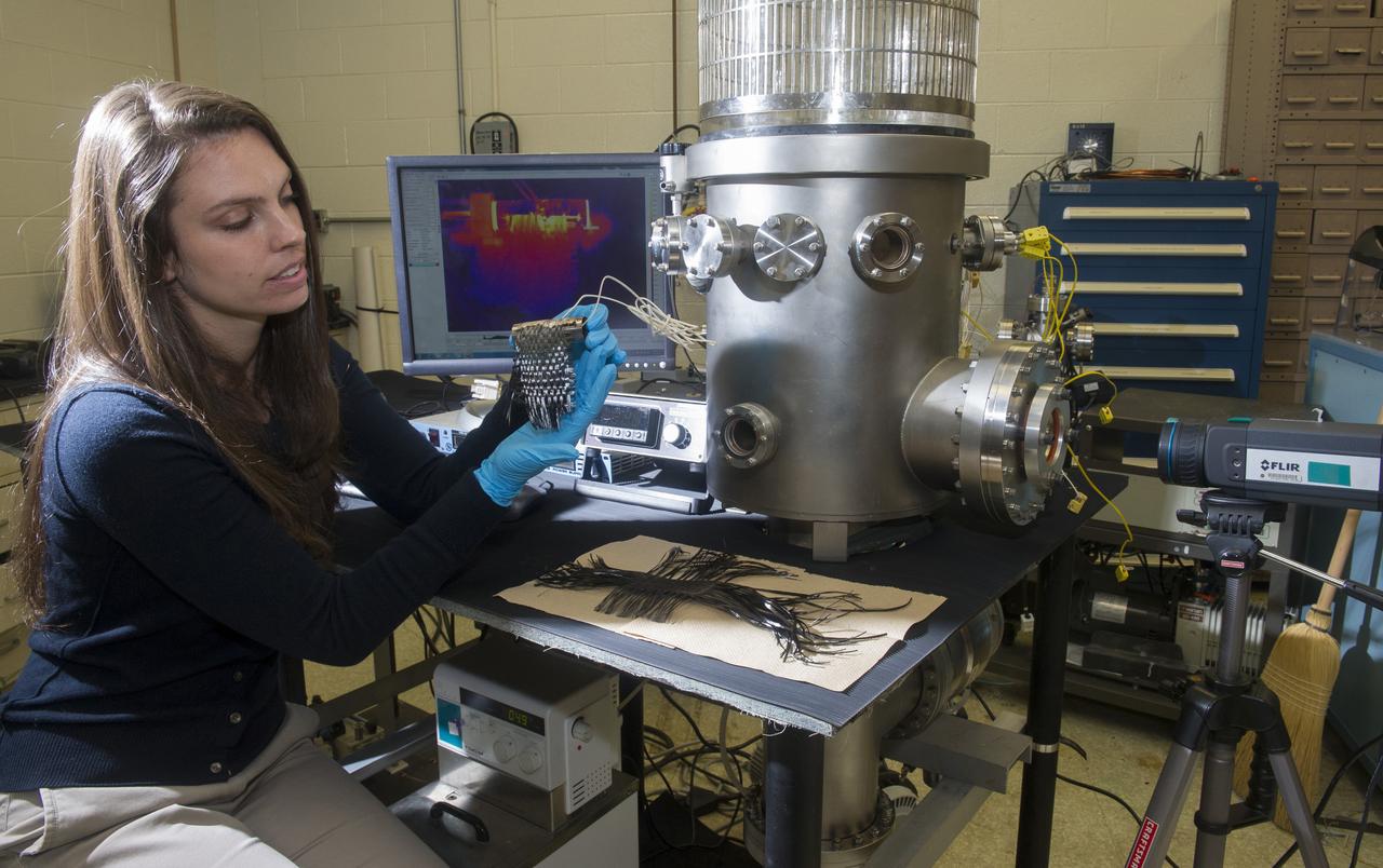 NASA SPACE TECHNOLOGY RESEARCH FELLOWSHIP (NSTRF) STUDENT BRIANA TOMBOULIAN AT THE 2013 MSFC RADIATOR FACILITY SHOWING A TEST ARTICLE