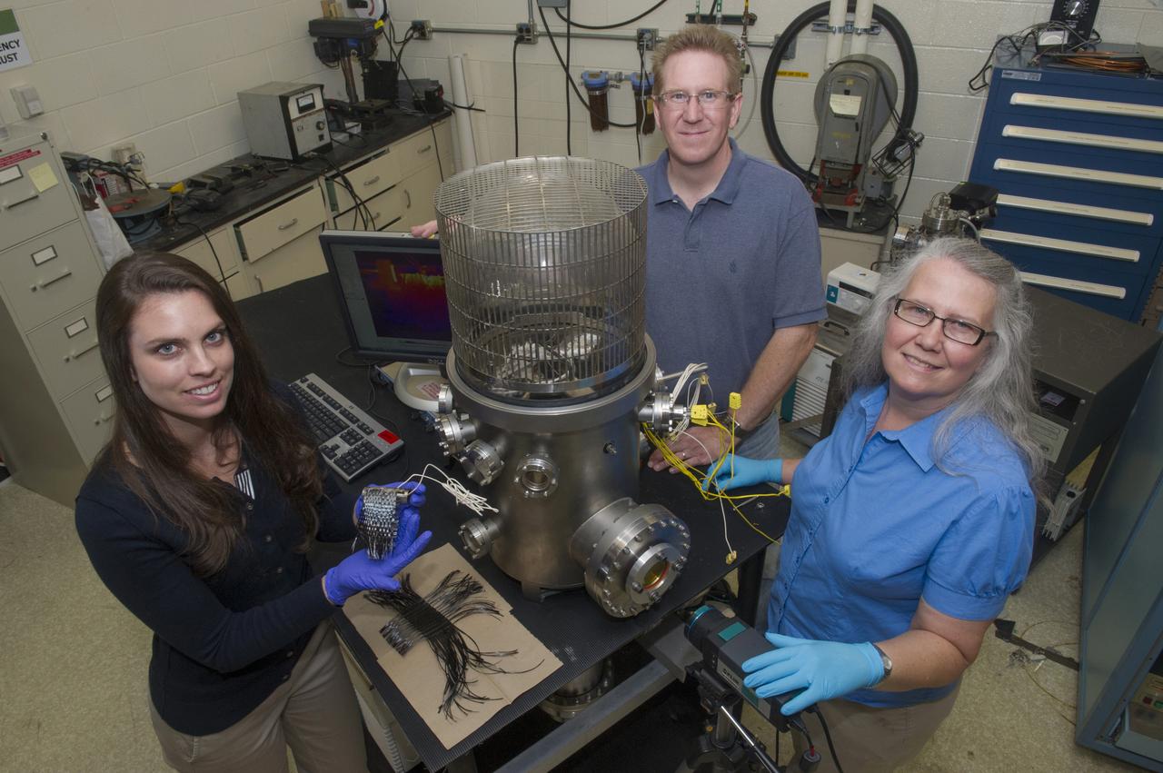 MEMBERS OF THE 2013 CIF RADIATOR PROJECT TEAM  AT THE TESTING FACILITY. RIGHT TO LEFT: TRUDY ALLEN, GLENN FOUNTAIN, NSTR STUDENT BRIANA TOMBOULIAN.-