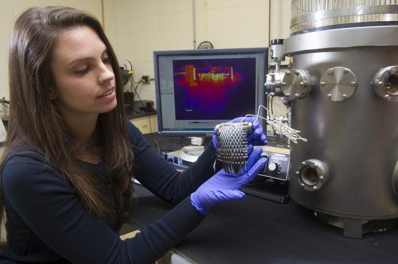 NASA SPACE TECHNOLOGY RESEARCH FELLOWSHIP (NSTRF) STUDENT BRIANA TOMBOULIAN AT THE 2013 MSFC RADIATOR FACILITY WITH A CARBON FIBER TEST ARTICLE