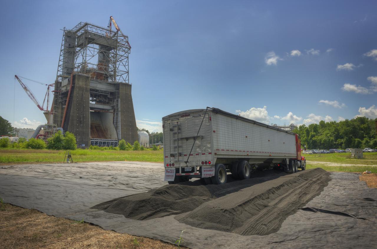 SOIL UNLOAD FOR THE SIMULATED PLANETARY BODY FIELD IN THE WEST TEST AREA. AREA TO BE USED FOR TESTING OF THE MIGHTY EAGLE LANDER