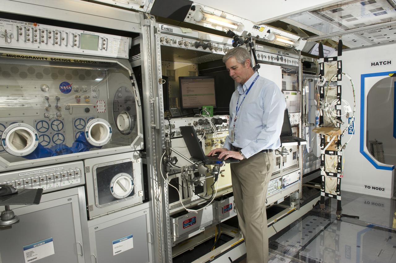 KARL ROTH IN THE LABORATORY TRAINING COMPLEX, A FACILITY USED TO SUPPORT TRAINING OF EXPERIMENT OPERATIONS ONBOARD THE INTERNATIONAL SPACE STATION