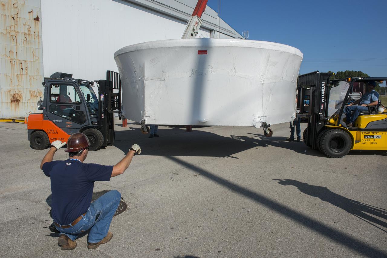 THE ORION EFT-1 DIAPHGRAM BEING UNLOADED AND UNWRAPPED PRIOR TO BEING PLACED IN THE CLEAN ROOM FOR TESTING.