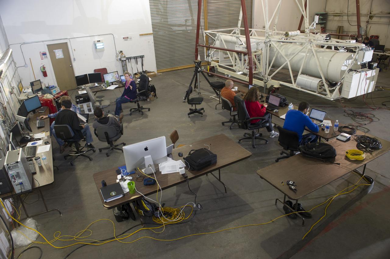 HEROES PAYLOAD AWAITS LAUNCH AS HELIUM BALLOON INFLATES IN BACKGROUND, FORT SUMNER, NEW MEXICO, SEPTEMBER 21, 2013