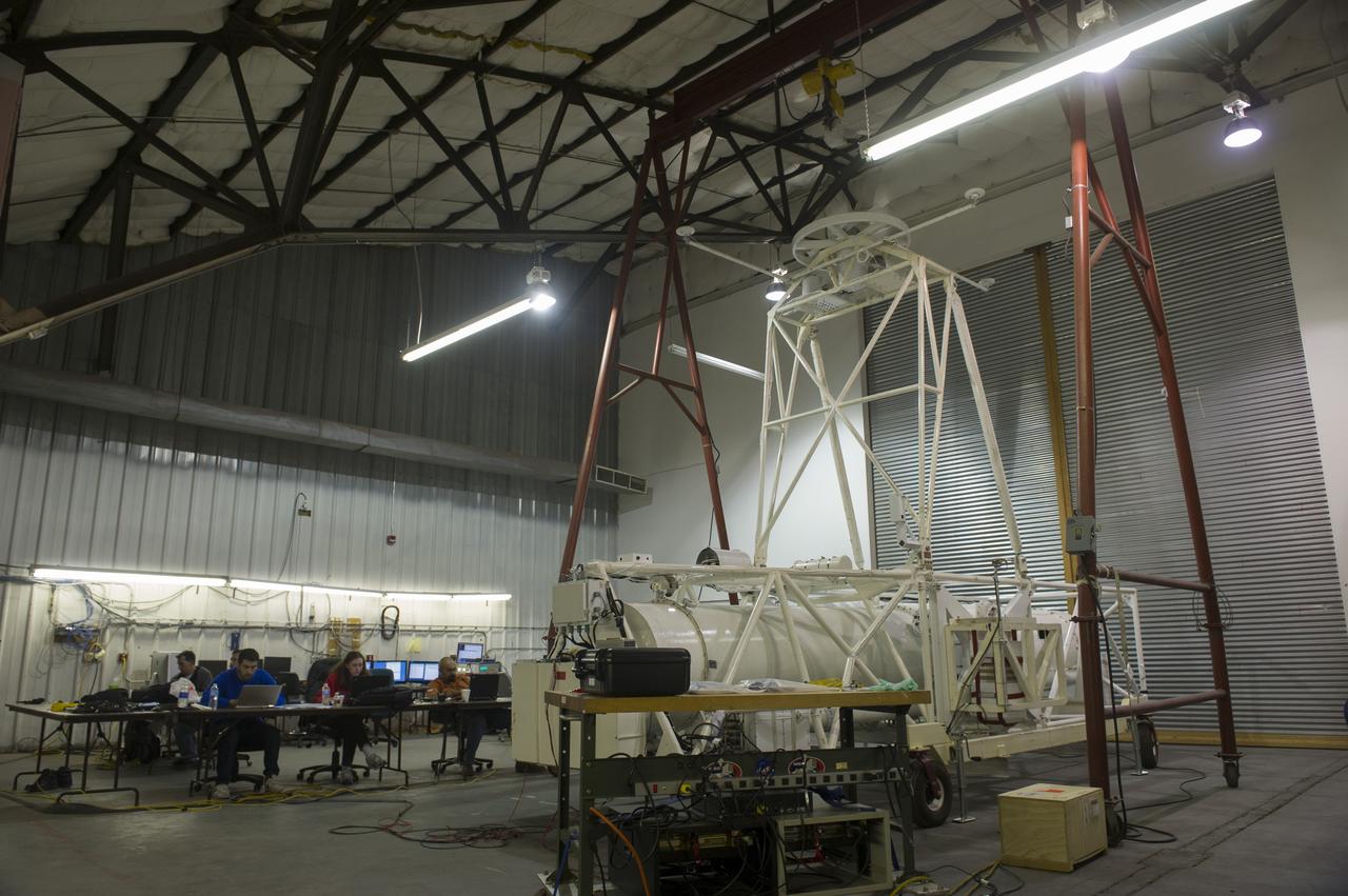 HEROES PAYLOAD AWAITS LAUNCH AS HELIUM BALLOON INFLATES IN BACKGROUND, FORT SUMNER, NEW MEXICO, SEPTEMBER 21, 2013