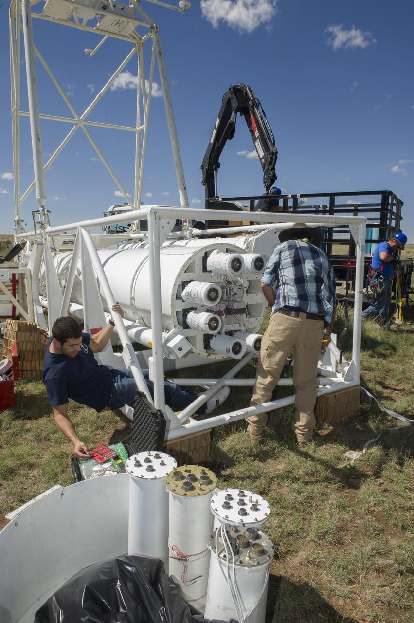 HEROES PAYLOAD AWAITS LAUNCH AS HELIUM BALLOON INFLATES IN BACKGROUND, FORT SUMNER, NEW MEXICO, SEPTEMBER 21, 2013