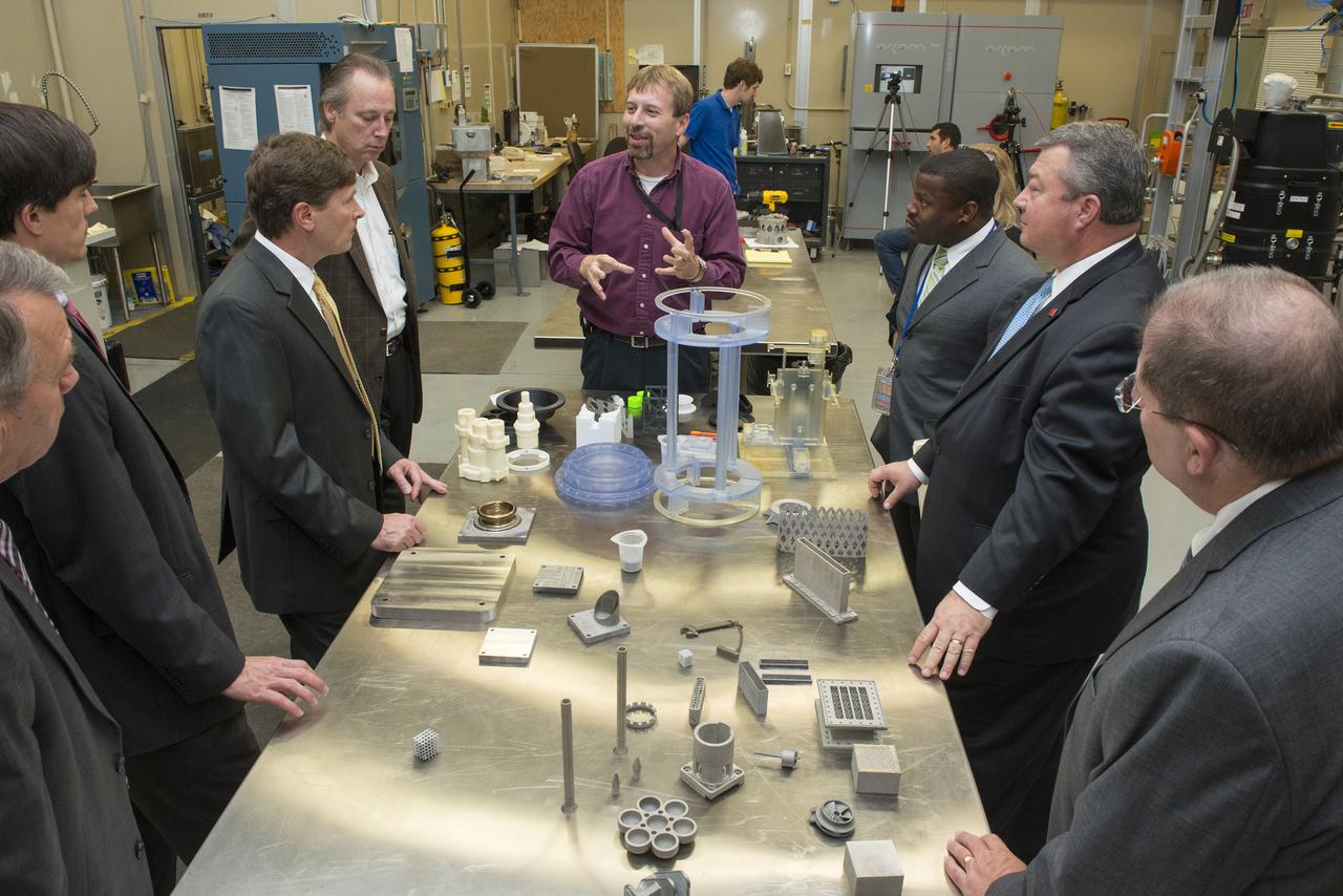 KEN COOPER GIVES AN OVERVIEW OF ADDITIVE MANUFACTURING TO STATE SENATOR BILL HOLTZCLAW, REPRESENTATIVE MAC MCCUTCHEON, GREG CANFIELD OF THE ALABAMA DEPARTMENT OF COMMERCE, GOVERNOR BENTLEY’S CHIEF OF STAFF, DAVID PERRY, AND LT. GOVERNOR STRANGES CHIEF OF STAFF, STEVE PELHAM.