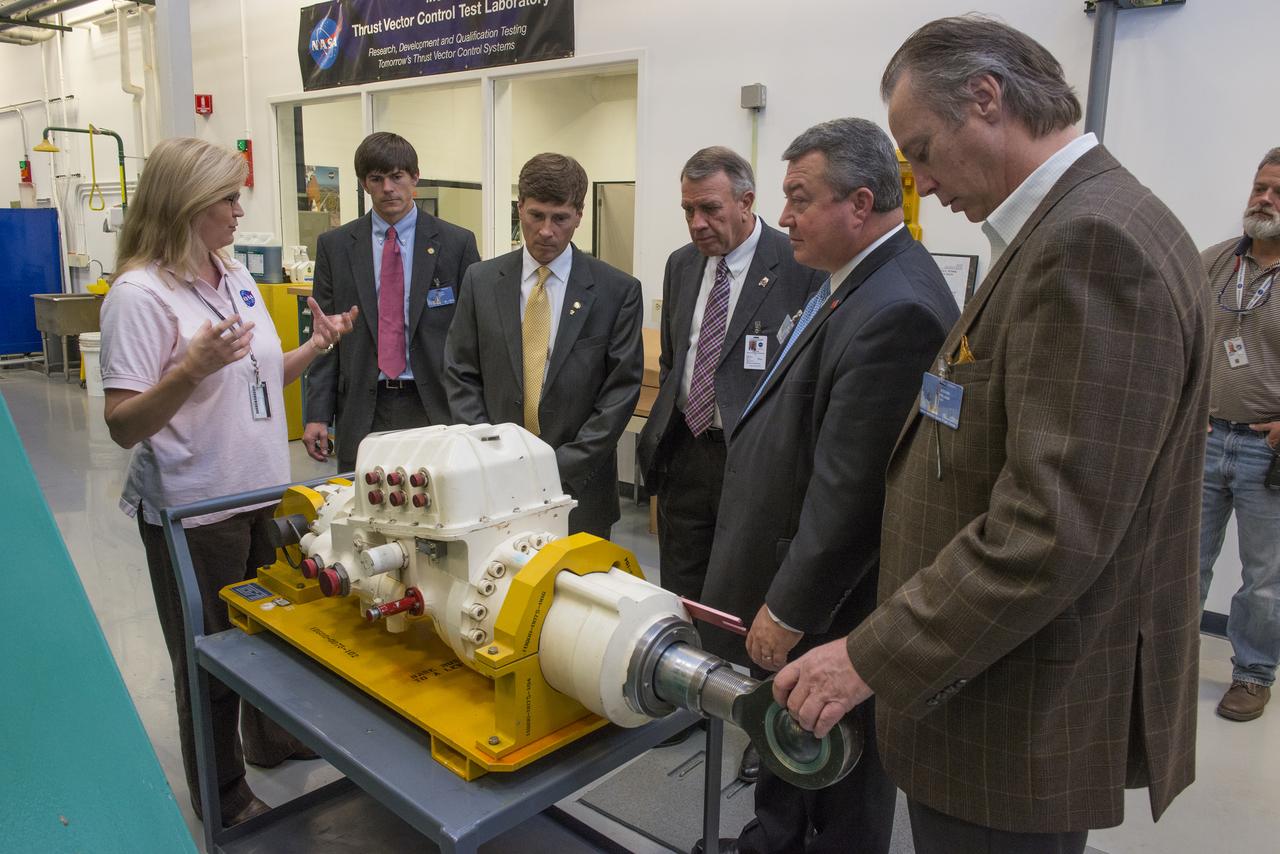 LISA BATES PROVIDES AN OVERVIEW OF THRUST VECTOR CONTROL  TO STATE SENATOR BILL HOLTZCLAW, REPRESENTATIVE MAC MCCUTCHEON, GREG CANFIELD OF THE ALABAMA DEPARTMENT OF COMMERCE, GOVERNOR BENTLEY’S CHIEF OF STAFF, DAVID PERRY, AND LT. GOVERNOR STRANGES CHIEF OF STAFF, STEVE PELHAM.