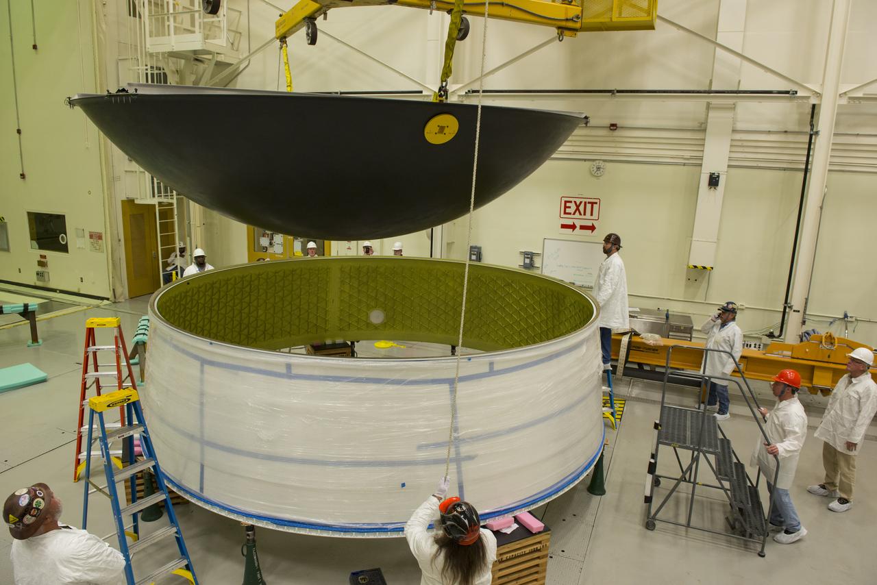 MATING OF THE MULTI-PURPOSE CREW VEHICLE STAGE ADAPTER (MSA) WITH ITS DIAPHRAGM IN BLDG. 4708. DECEMBER 20, 2014.