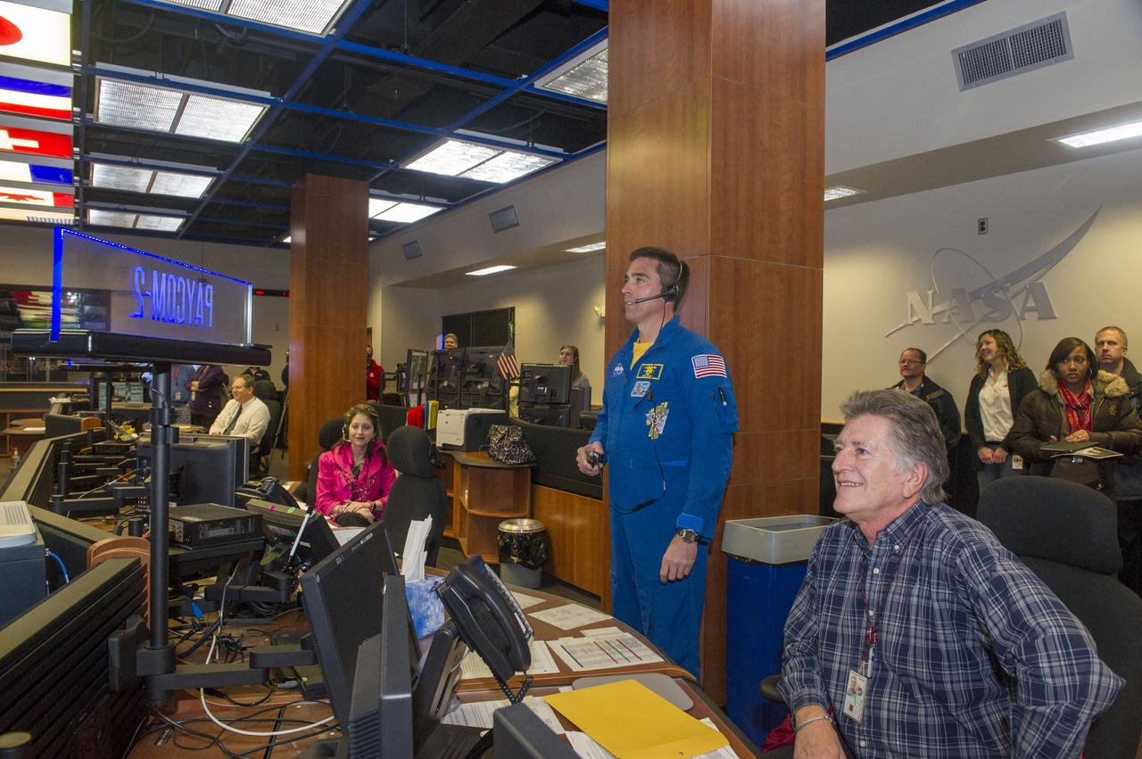 NASA ASTRONAUT CHRIS CASSIDY TALKS LIVE WITH CURRENT ISS CREW MEMBERS DURING A VISIT TO THE PAYLOAD OPERATIONS INTEGRATION CENTER, OR THE POIC, AS PART OF A MARSHALL SPACE FLIGHT CENTER VISIT JAN. 22. 