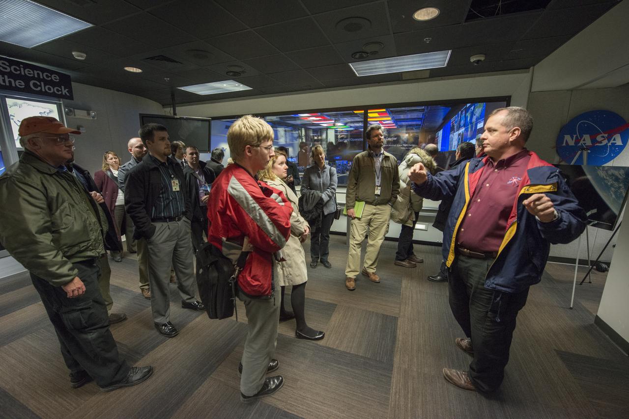 SPACE STATION SCIENCE INVESTIGATORS FROM AROUND THE WORLD TOUR THE PAYLOAD OPERATIONS INTEGRATION CENTER (POIC). THE TOUR WAS LED BY ASTRONAUT AND PAYLOAD OPERATIONS DIRECTOR AT MSFC T.J. CREAMER. WHEN SCIENTIFIC EXPERIMENTS REACH THE STATION, PARTICIPANTS IN THE TOUR WILL WORK WITH MSFC CONTROLLERS IN THE POIC WHO CAN SEND COMMANDS TO THE EXPERIMENTS, MONITOR DATA, AND ASSIST THE ISS CREW.
