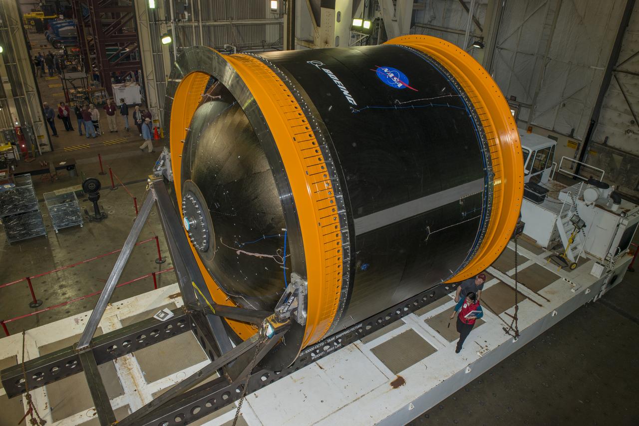 NASA AND BOEING ENGINEERS INSPECT AND PREPARE ONE OF THE LARGEST COMPSITE ROCKET PROPELLANT TANKS EVER MANUFACTURED. THE COMPOSITE CRYOTANK PROMISES A 30% WEIGHT REDUCTION AND A 25 % COST REDUCTION OVER THE PREVIOUSLY USED METAL TANKS.