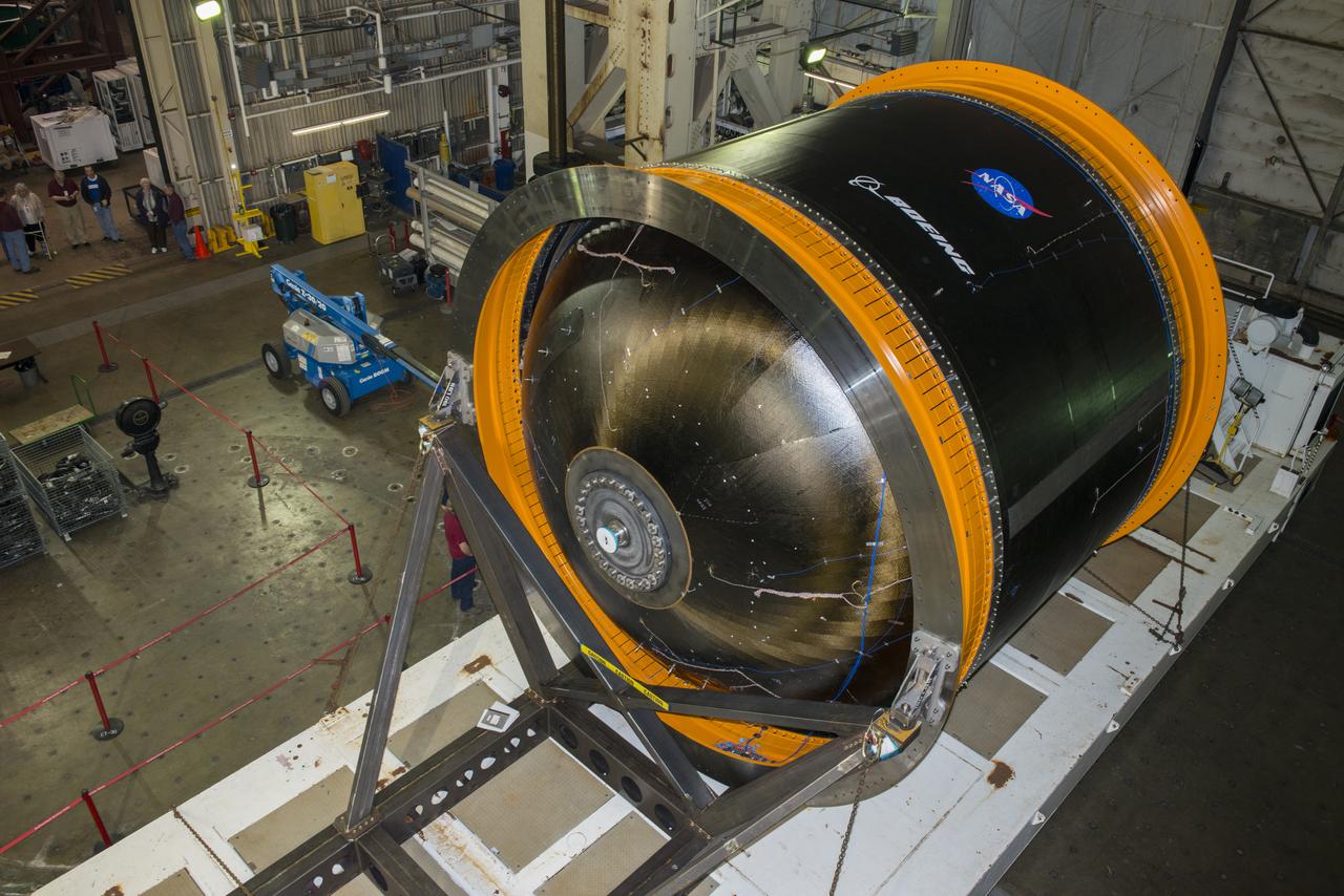 NASA AND BOEING ENGINEERS INSPECT AND PREPARE ONE OF THE LARGEST COMPSITE ROCKET PROPELLANT TANKS EVER MANUFACTURED. THE COMPOSITE CRYOTANK PROMISES A 30% WEIGHT REDUCTION AND A 25 % COST REDUCTION OVER THE PREVIOUSLY USED METAL TANKS.