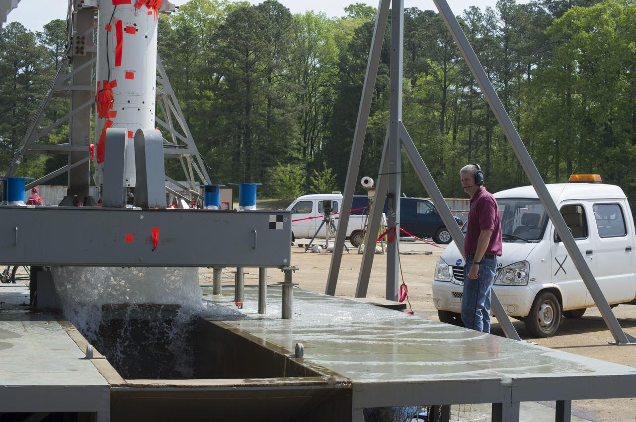 TEST ENGINEER DENNIS STRICKLAND CONDUCTS WATER FLOW TESTS AT TEST STAND 116 FOR SPACE LAUNCH SYSTEM SCALE MODEL ACOUSTIC TEST SERIES (WITH SOLID ROCKET BOOSTERS)