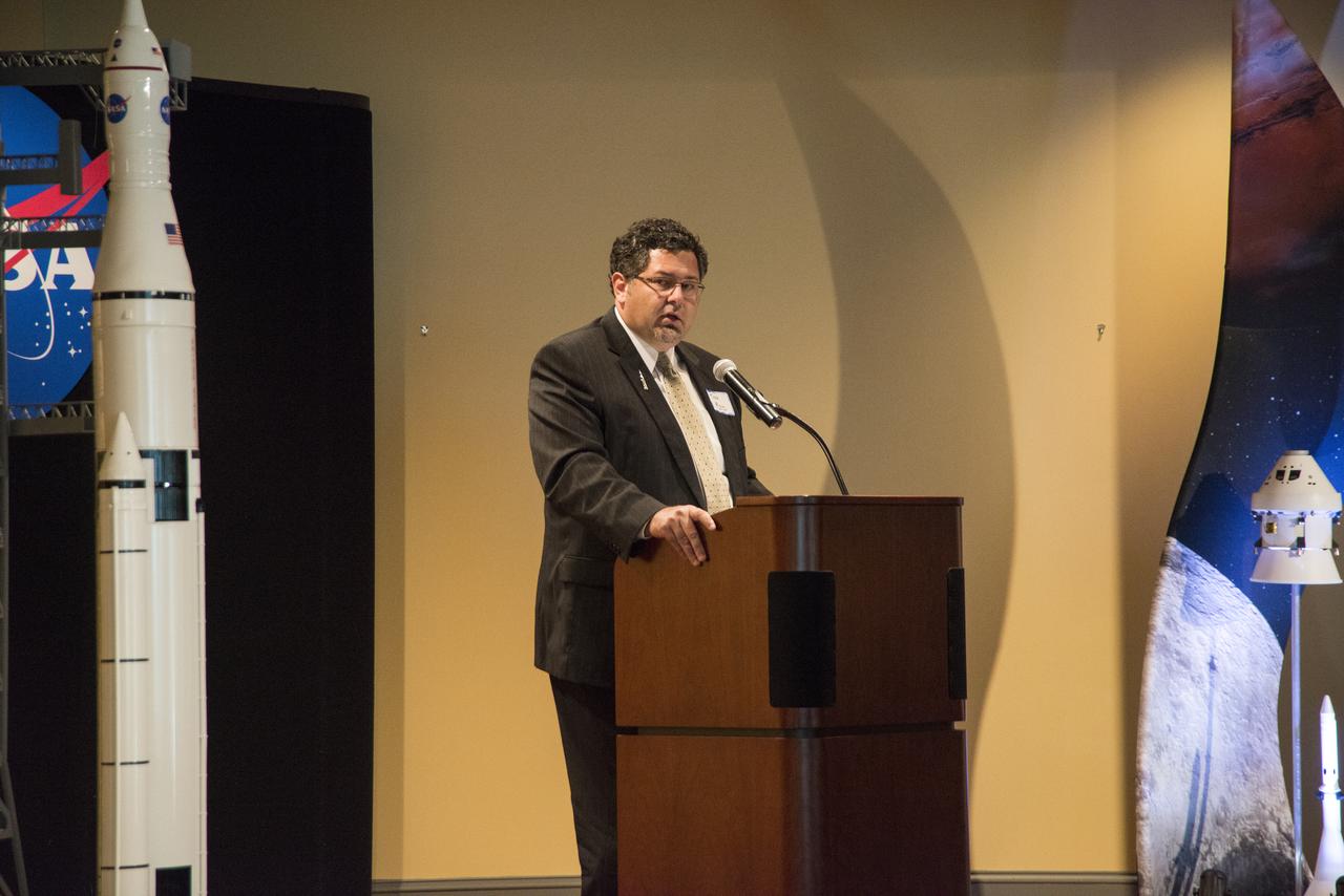 TODD MAY, PROGRAM MANAGER, SPACE LAUNCH SYSTEMS AT NASA, ADDRESSES THE SMBA ESD-HUB ZONE EVENT AT THE HUNTSVILLE MUSEUM OF ART.