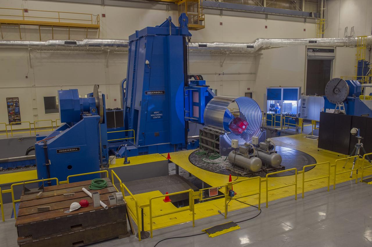 DAVID OSBORNE, A MACHINIST ON THE METTS CONTRACT, OPERATES THE 7-AXIS MILLING MACHINE WITH CF1 BARREL BEING PREPARED FOR SHELL BUCKLE TESTING