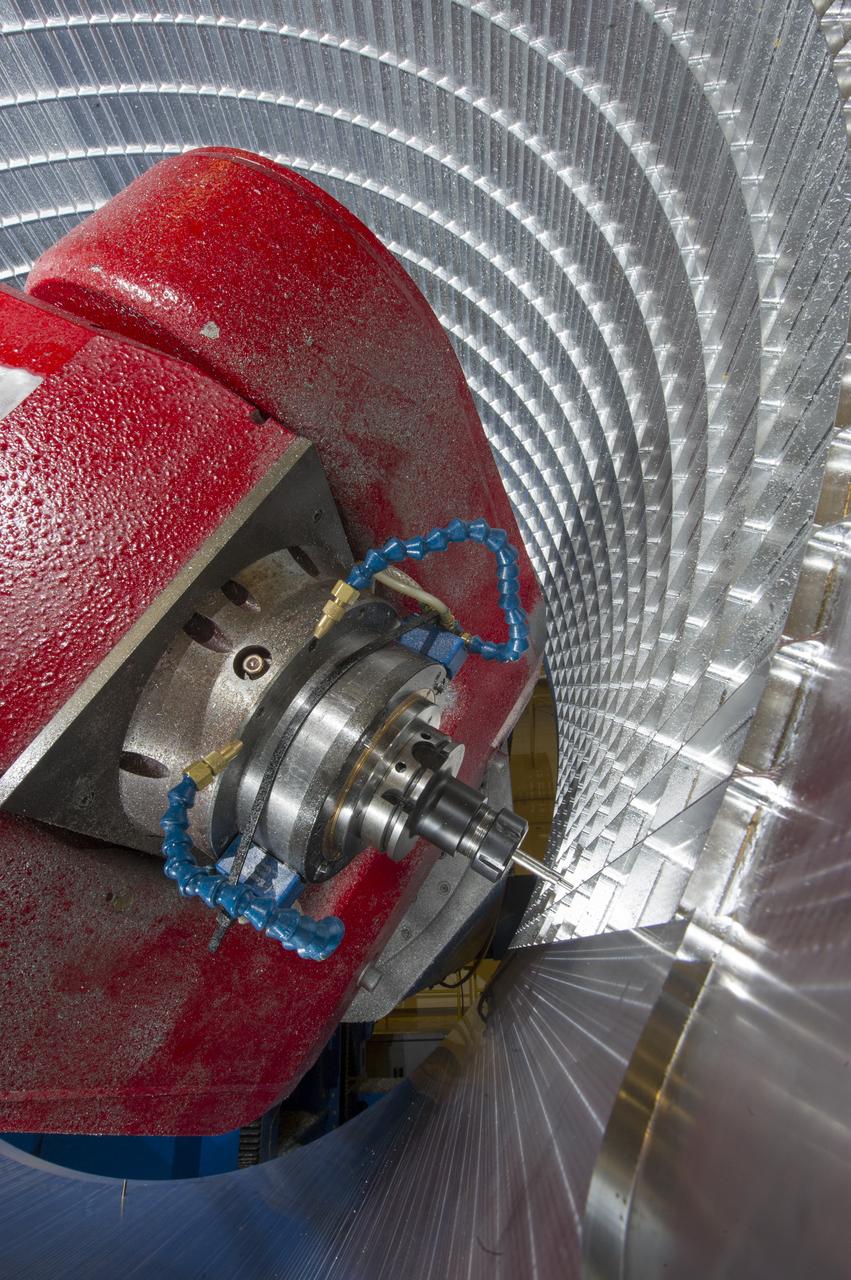 7-AXIS MILLING MACHINE CUTS ORTHOGRID TOOL PATH ON 8 FOOT CF1 BARREL IN SUPPORT OF SHELL BUCKLE TESTING