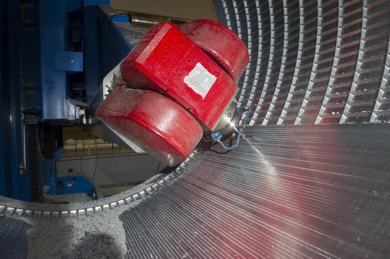 7-AXIS MILLING MACHINE CUTS ORTHOGRID TOOL PATH ON 8 FOOT CF1 BARREL IN SUPPORT OF SHELL BUCKLE TESTING