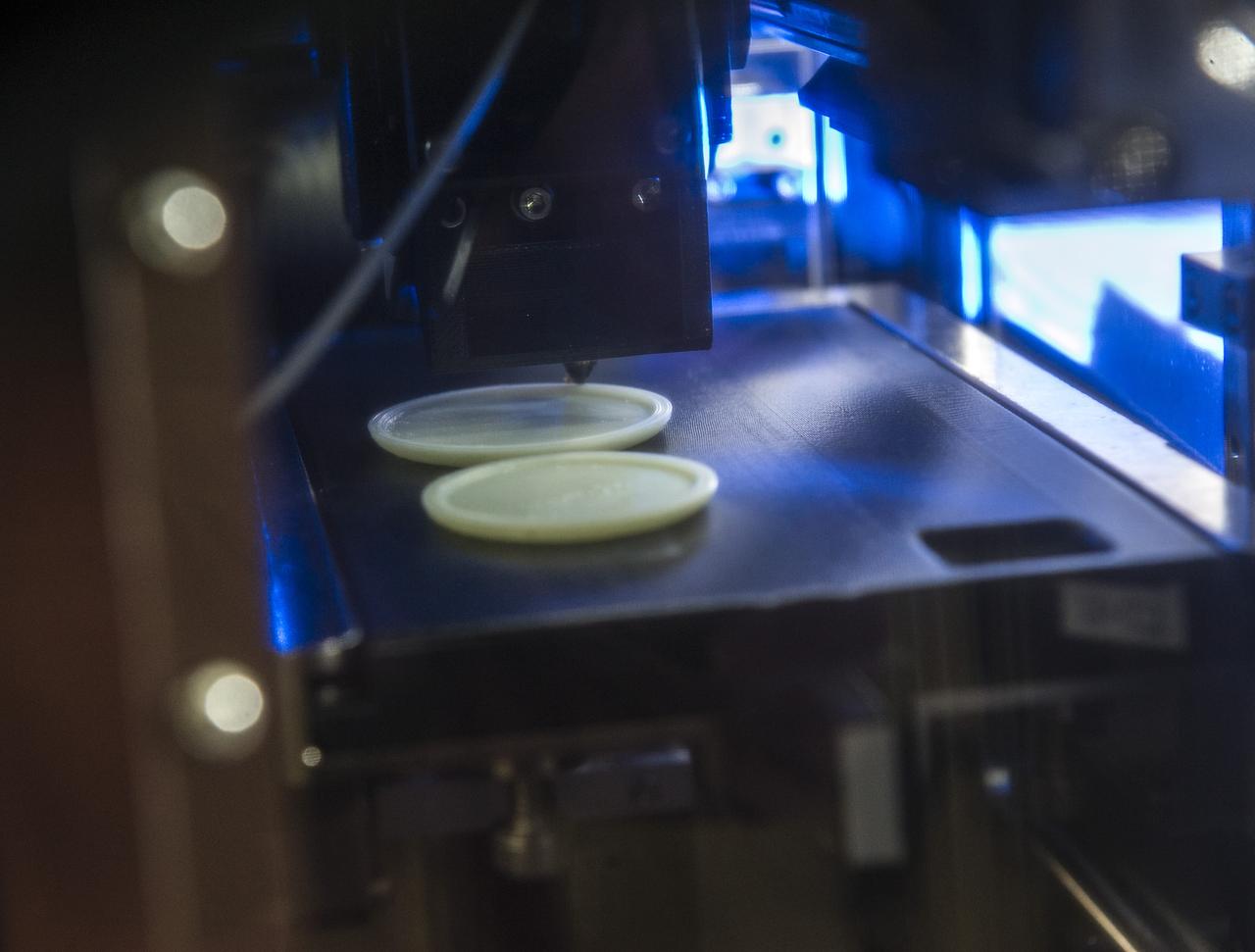 MADE IN SPACE” 3D PRINTER PRINTING TEST SAMPLES WHILE PRINTER IS IN MICROGRAVITY GLOVE BOX