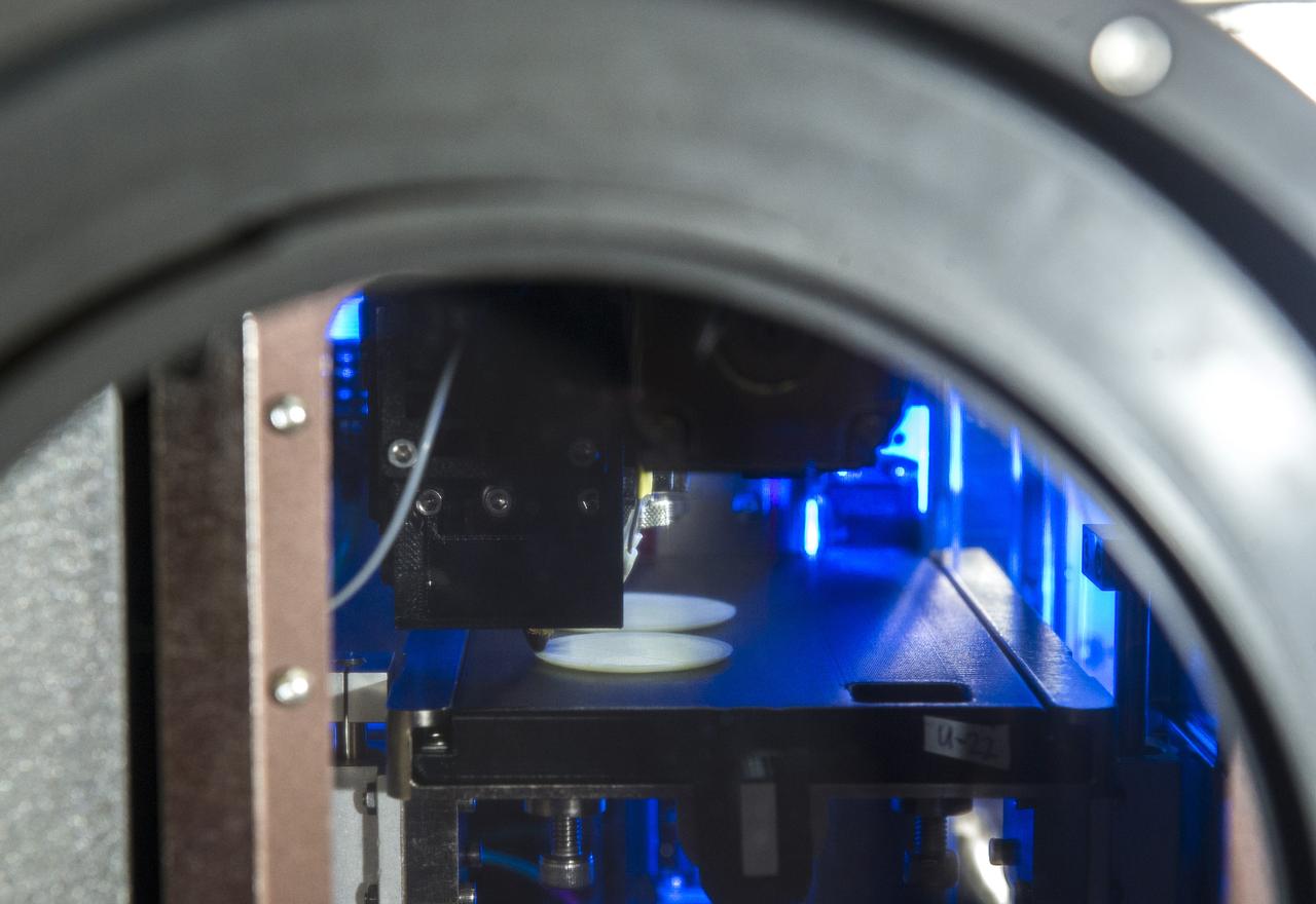 MADE IN SPACE” 3D PRINTER PRINTING TEST SAMPLES WHILE PRINTER IS IN MICROGRAVITY GLOVE BOX