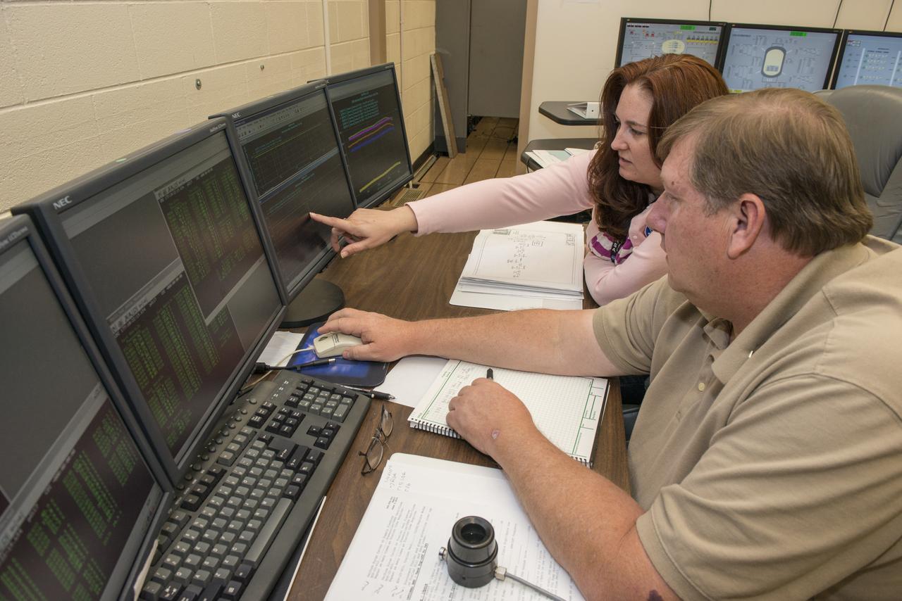 BECKY CROWNOVER AND JIM SISCO MONITOR TESTING OF THE CPST (CRYOTANK) TANK TEST IN BUILDING 4561 IN THE EAST TEST AREA.