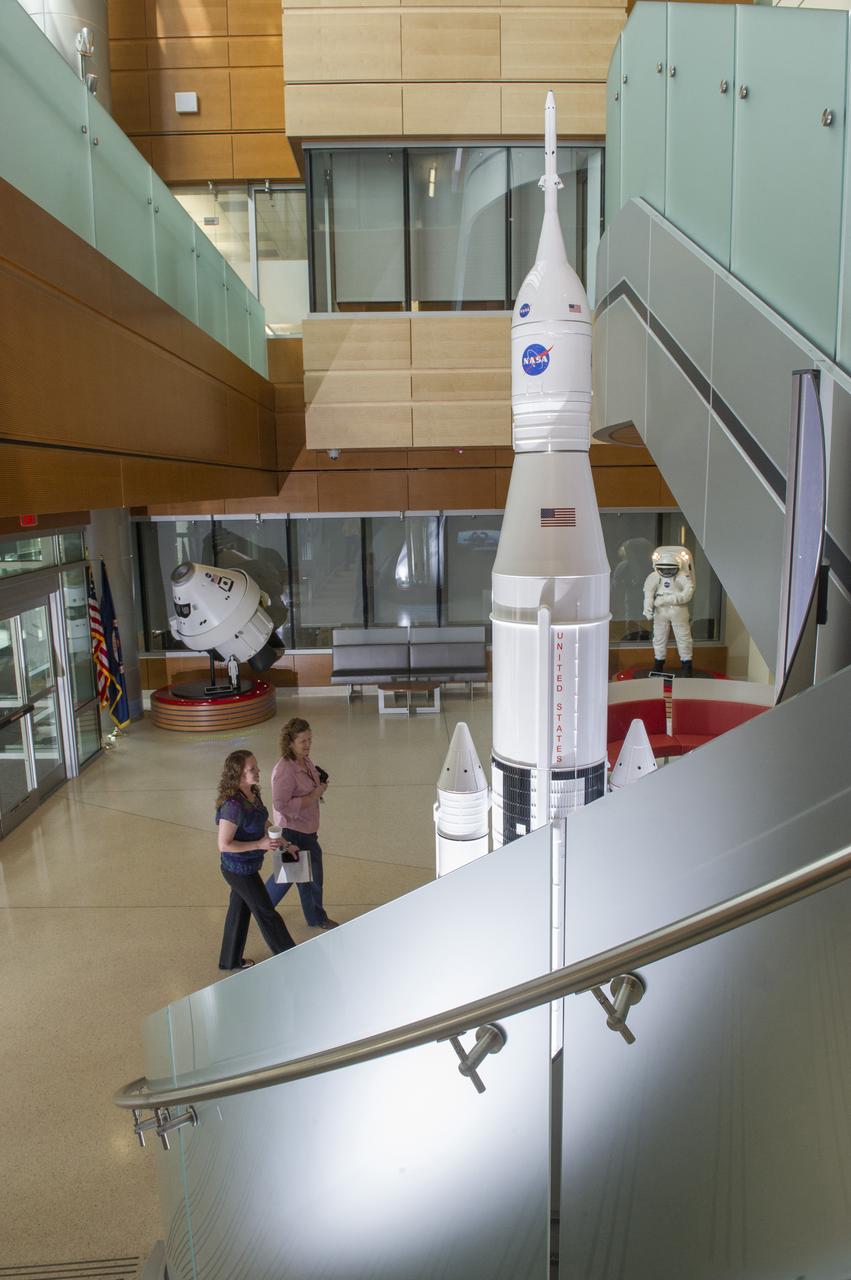 THE INTERIOR OF THE MARSHALL SPACE FLIGHT CENTER’S NEWLY OPENED BUILDING 4220, PRIMARILY HOME TO THE SPACE LAUNCH SYSTEM PROGRAM, REFLECTS A BLEND OF AESTHETICS, PRACTICALITY AND HIGH EFFICIENCY. THE COST-CONSCIOUS NEW FACILITY IS ENVIRONMENTALLY FRIENDLY ON ALL FRONTS, FEATURING STATE-OF-THE-ART GREEN TECHNOLOGIES AND ENERGY-CONSERVATION SYSTEMS THROUGHOUT THE BUILDING. THE ENTIRE STRUCTURE IS SPECIALLY INSULATED, WITH MUCH OF THE EXTERIOR COVERED IN LOW-EMISSIVITY GLASS THAT DEFLECTS HEAT TO REDUCE COOLING COSTS WITHIN. ROOFTOP SOLAR-POWER UNITS ABSORB ENERGY TO AUGMENT ELECTRICAL POWER, AND A 10,000-GALLON CISTERN COLLECTS STORMWATER TO IRRIGATE THE SURROUNDING GREENERY. EVEN THE FACILITY'S NEW PARKING LOT HAS A GREEN ELEMENT: RATHER THAN GUTTERS, IT INCLUDES A "BIOSWALE," A NATURAL, SOIL-AND-VEGETATION-BASED MEANS OF CAPTURING AND FILTERING STORMWATER RUNOFF, WHICH IS DIRECTED INTO A NEARBY COLLECTING POND. ONCE CERTIFICATION IS COMPLETE, BUILDING 4220 WILL BECOME THE SEVENTH LEED CERTIFIED MARSHALL STRUCTURE ON CAMPUS