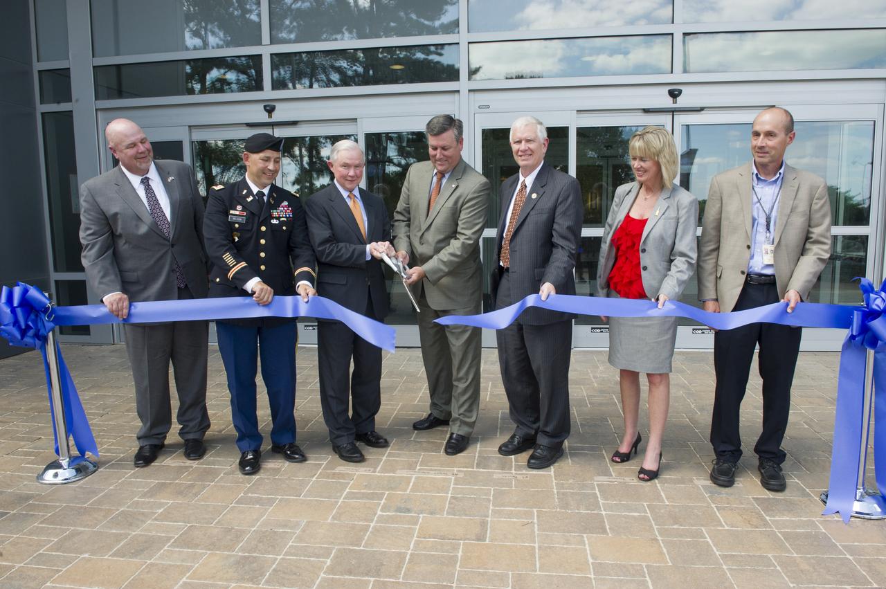 AIDING IN THE OFFICIAL BUILDING 4220 RIBBON-CUTTING ARE, FROM LEFT, JOHN HONEYCUTT, DEPUTY MANAGER OF THE SPACE LAUNCH SYSTEM PROGRAM OFFICE; LT. COL. TOM NELSON, DEPUTY COMMANDER OF THE U.S. ARMY CORPS OF ENGINEERS-MOBILE DISTRICT; U.S. SEN. JEFF SESSIONS OF ALABAMA; MARSHALL CENTER DIRECTOR PATRICK SCHEUERMANN; U.S. REP. MO BROOKS OF ALABAMA'S 5TH DISTRICT; MARSHALL DEPUTY DIRECTOR TERESA VANHOOSER; AND MARSHALL ENGINEER DAVID SKRIDULIS, TEAM LEAD FOR THE FACILITIES MANAGEMENT OFFICE'S CIVIL STRUCTURAL GROUP.