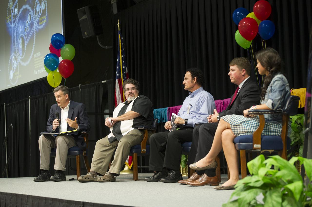 MEMBERS OF SPACE 2100 TEAM PRESENT KEYNOTE ADDRESS AT 2014 CIO AWARDS CEREMONY. (L TO R) DREW SMITH, PABLO GARCIA, DR. PETER CURRERI, CHRIS WHITE, AND ALAYNA DEVINENI
