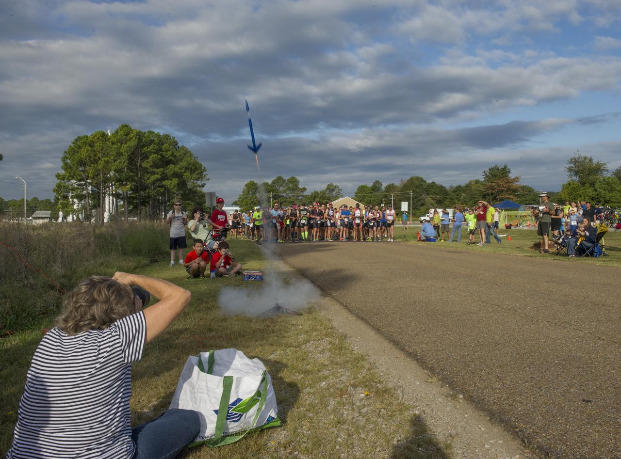 A MODEL ROCKET SIGNALS THE START OF THE ANNUAL RACIN' THE STATION DUATHLON AT THE MARSHALL SPACE FLIGHT CENTER SEPT. 27