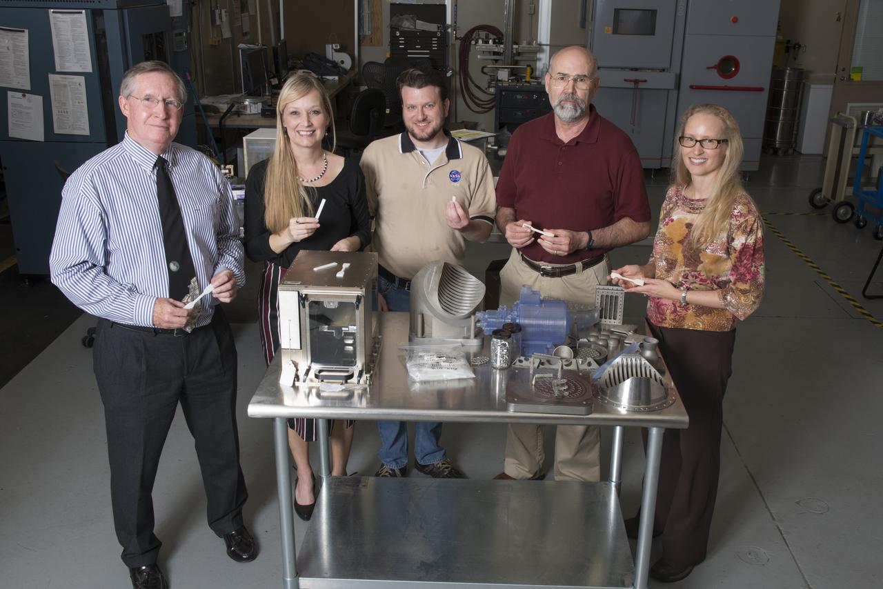 GROUP PHOTOGRAPH OF MEMBERS OF THE 3-D PRINTER TEAM IN THE ADDITIVE MANUFACTURING LAB IN BUILDING 4707. (L TO R) RAYMOND (CORKY) CLINTON, NIKKI WERKHEISER; QUINCY BEAN; RICK RYAN; AND JENNIFER EDMUNSON