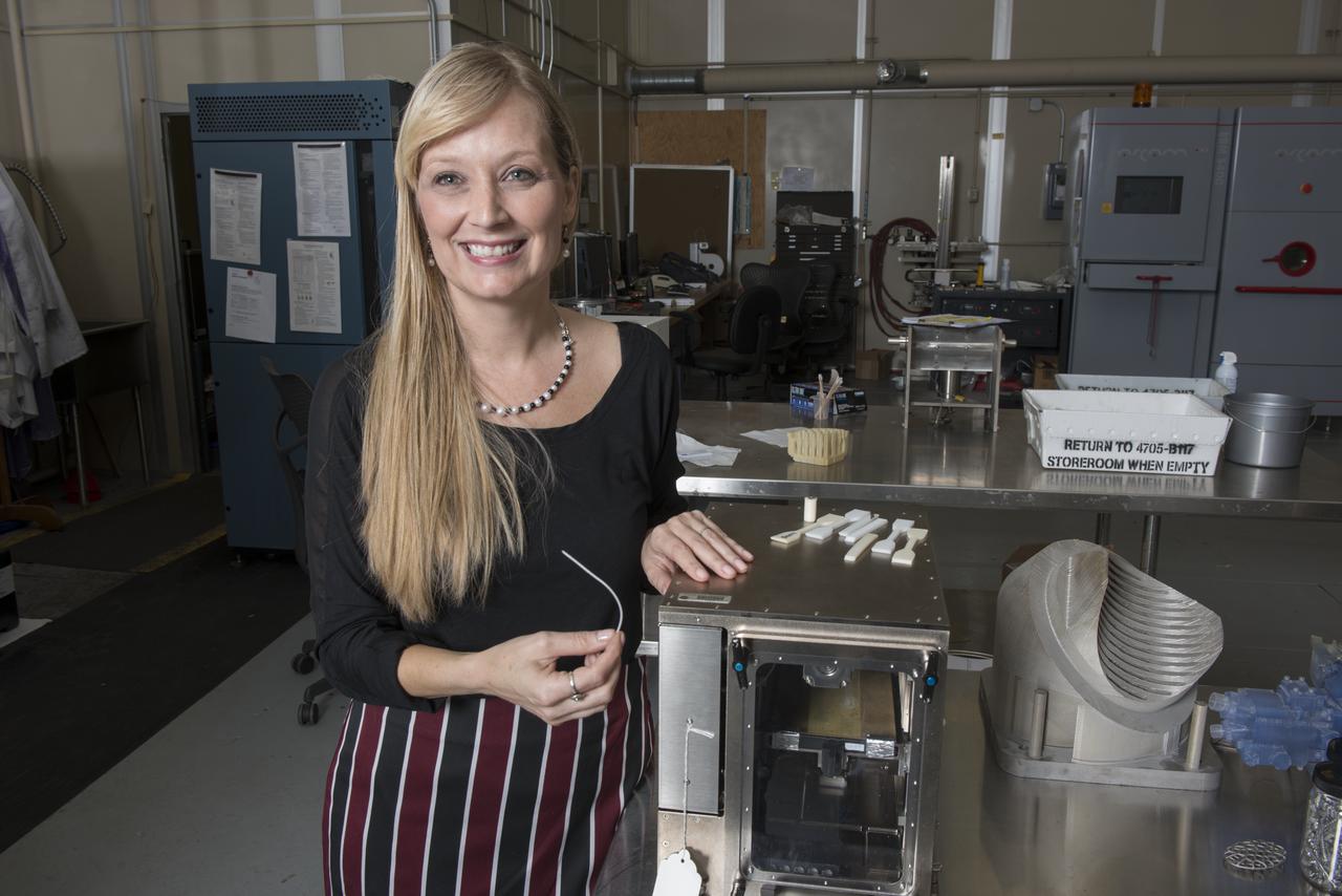 NIKKI WERKHEISER EXAMINES THE RAW MATERIAL USED IN THE FIRST 3-D PRINTER TO BE SENT TO THE ISS WHICH IS DESIGNED TO BE A TEST BED FOR MANUFACTURING SMALL AS ARTICLES AS NEEDED.