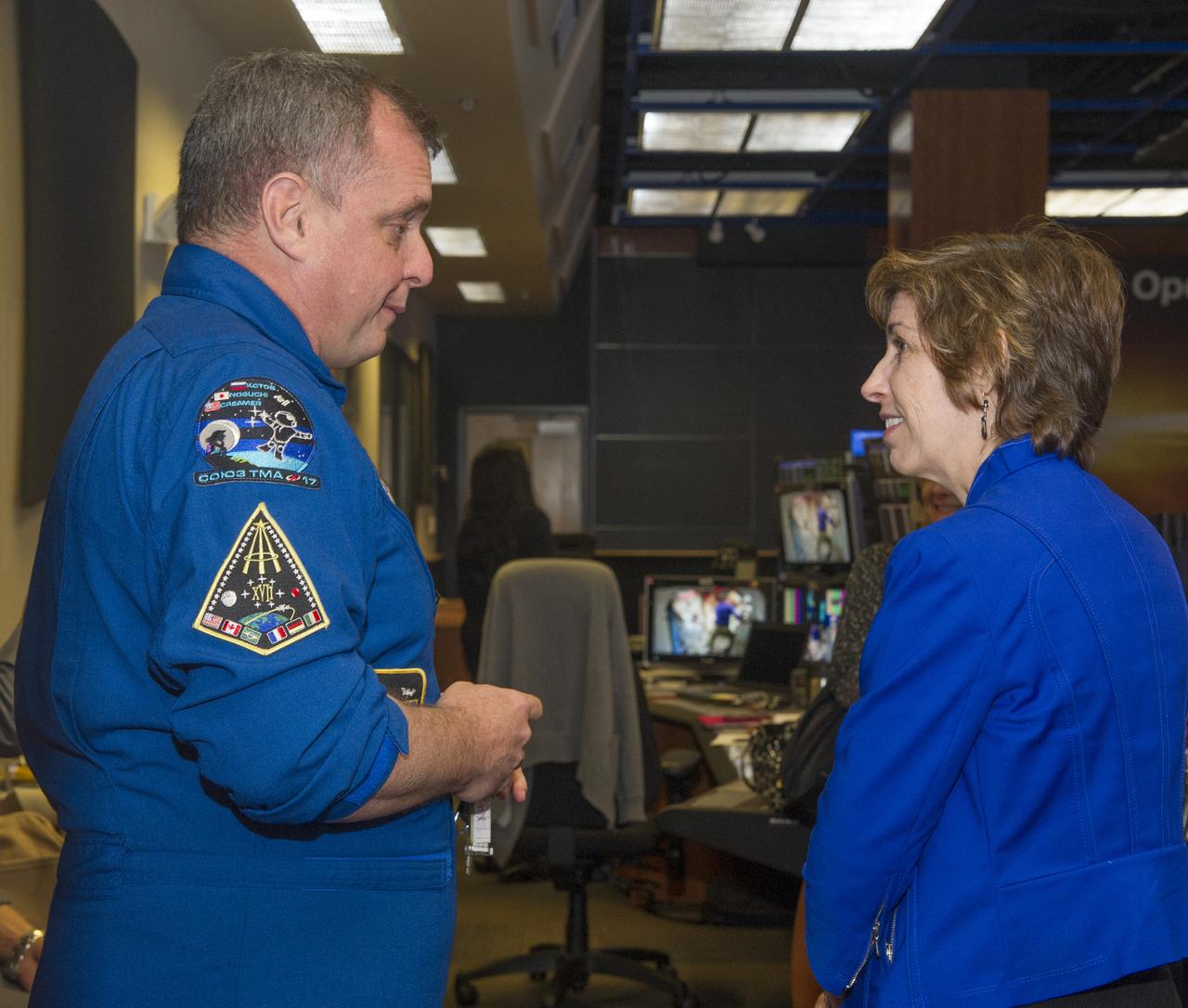 ASTRONAUT T.J. CREAMER OF ISS EXPEDITION 22 AND 23, GREETS DR. ELLEN OCHOA INSIDE THE PAYLOAD OPERATIONS INTEGRATION CENTER FOR THE ISS