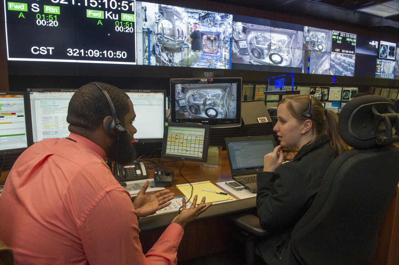 DARIAN BRYANT, LEFT, AND MELISSA HOPPER, STOWAGE ENGINEERS WITH THE PAYLOAD OPERATIONS INTEGRATION CENTER AT NASA'S MARSHALL SPACE FLIGHT CENTER WORK WITH NASA ASTRONAUT BARRY "BUTCH" WILMORE TO CALIBRATE THE FIRST 3-D PRINTER FLOWN ON THE INTERNATIONAL SPACE STATION.