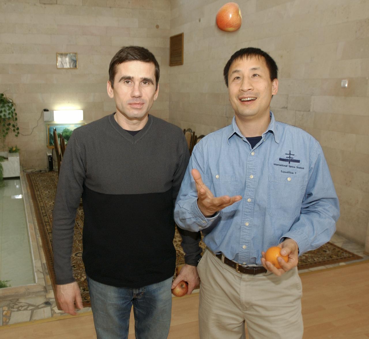 Expedition 7 commander Yuri I. Malenchenko, left, and NASA International Space Station Science Officer and Flight Engineer Edward T. Lu relax after dinner at the Cosmonaut Hotel in Baikonur, Kazakhstan, Wednesday, April 9, 2003. Photo Credit: (NASA/Bill Ingalls)