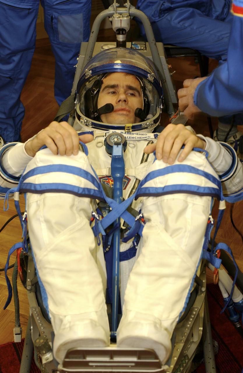 Expedition 7 Commander Yuri I. Malenchenko has a leak check performed on his Russian Sokol suit in the Soyuz Integration Facility at the Baikonur Cosmodrome in Baikonur, Kazakhstan, Thursday, April 10, 2003. Photo Credit: (NASA/Bill Ingalls)