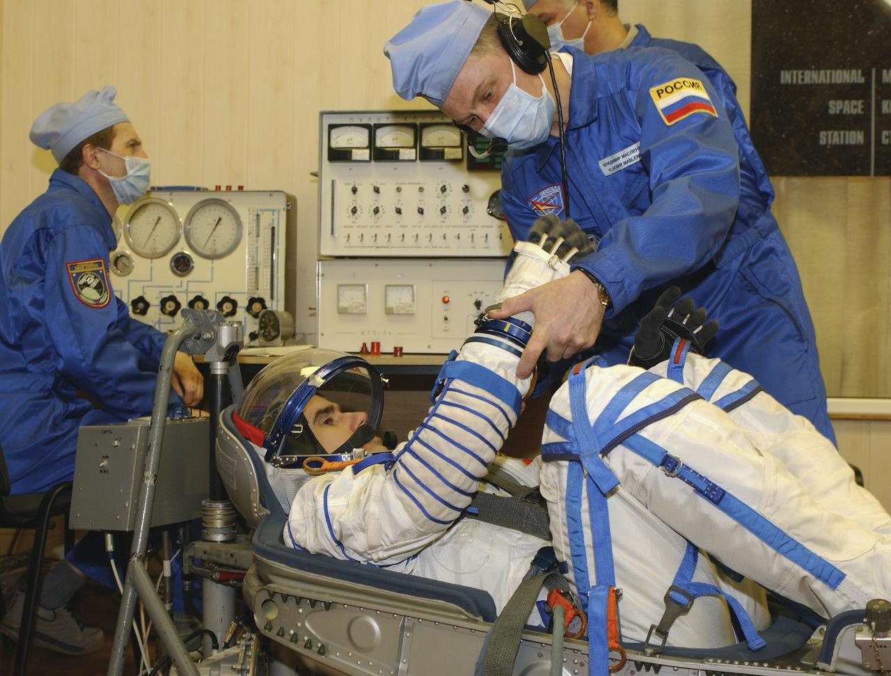 Expedition 7 Commander Yuri I. Malenchenko has a leak check performed on his Russian Sokol suit in the Soyuz Integration Facility at the Baikonur Cosmodrome in Baikonur, Kazakhstan, Thursday, April 10, 2003. Photo Credit: (NASA/Bill Ingalls)