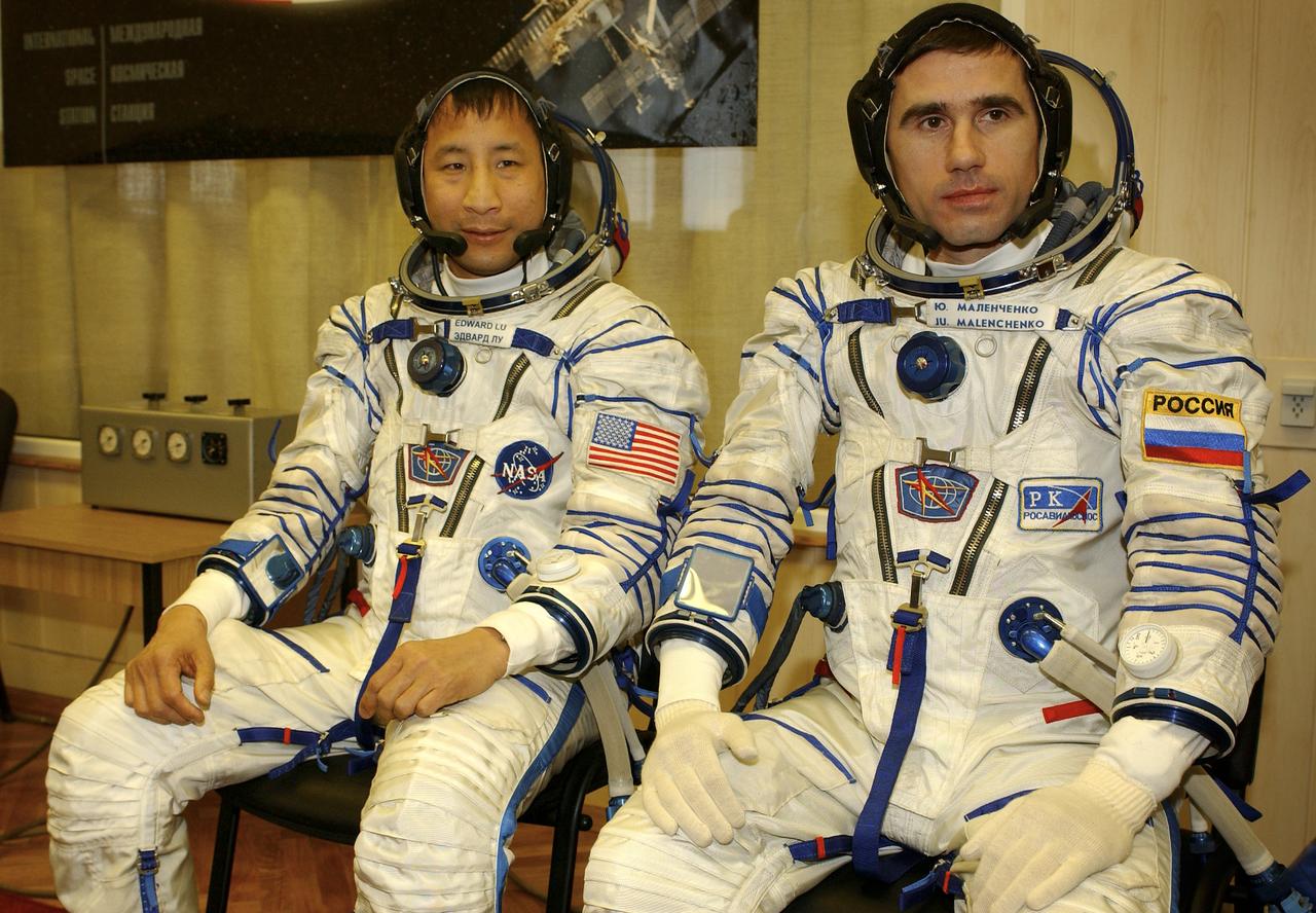 NASA International Space Station Science Officer and Flight Engineer for Expedition 7 Edward T. Lu, left and Expedition 7 Commander Yuri I. Malenchenko wait to have their Russian Sokol suits tested at the Soyuz Integration Facility at the Baikonur Cosmodrome in Baikonur, Kazakhstan, Thursday, April 10, 2003. Photo Credit: (NASA/Bill Ingalls)